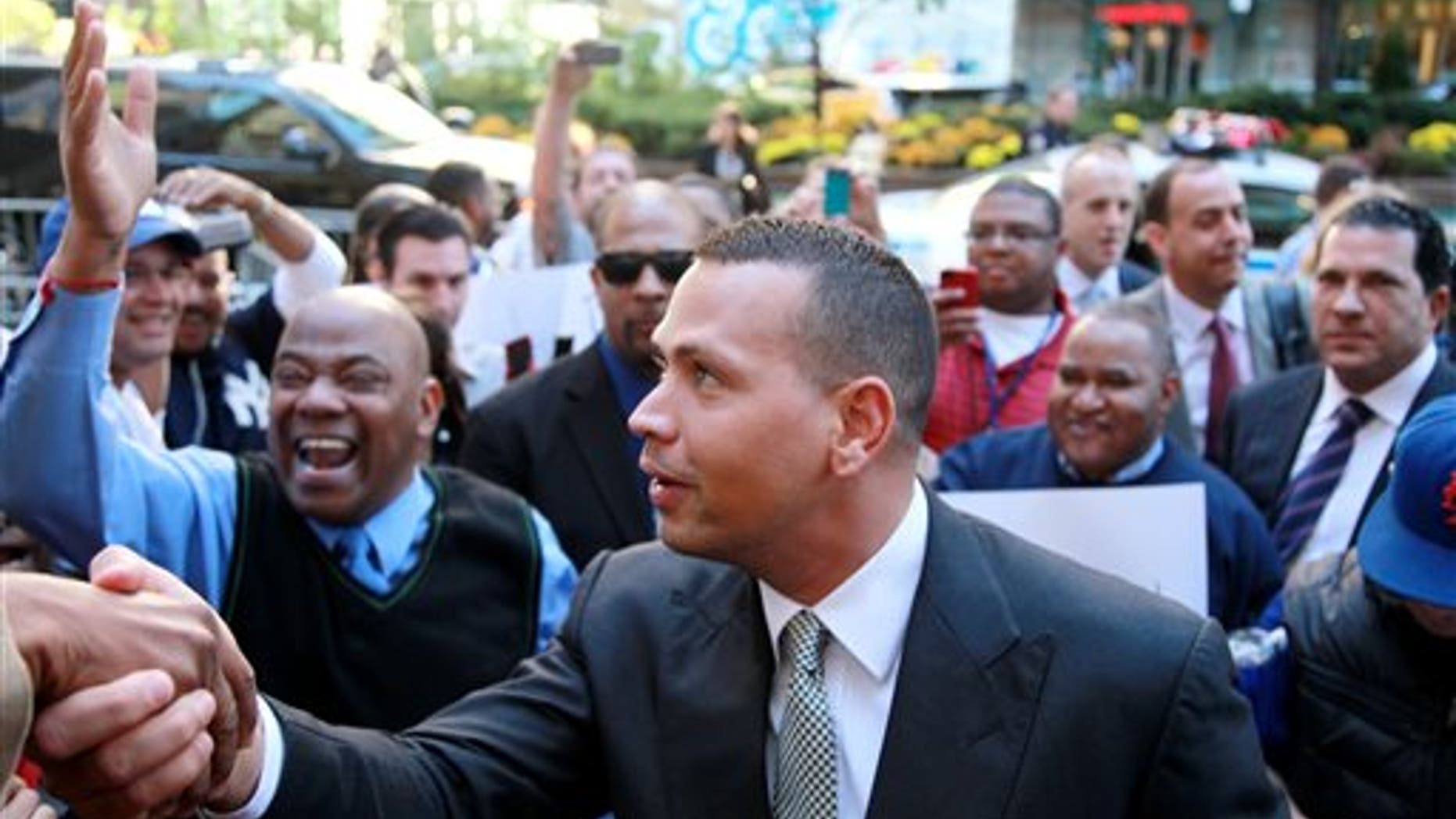FILE - In this Oct. 1, 2013, file photo, New York Yankees' Alex Rodriguez arrives at the offices of Major League Baseball in New York. Rodriguez's 211-game suspension was the longest of the 13 announced in August for players connected to a Florida anti-aging clinic accused of distributing banned PEDs. The Yankees' slugger was the only one to contest the penalty, and the year ends with an arbitrator yet to rule. (AP Photo/David Karp, File)