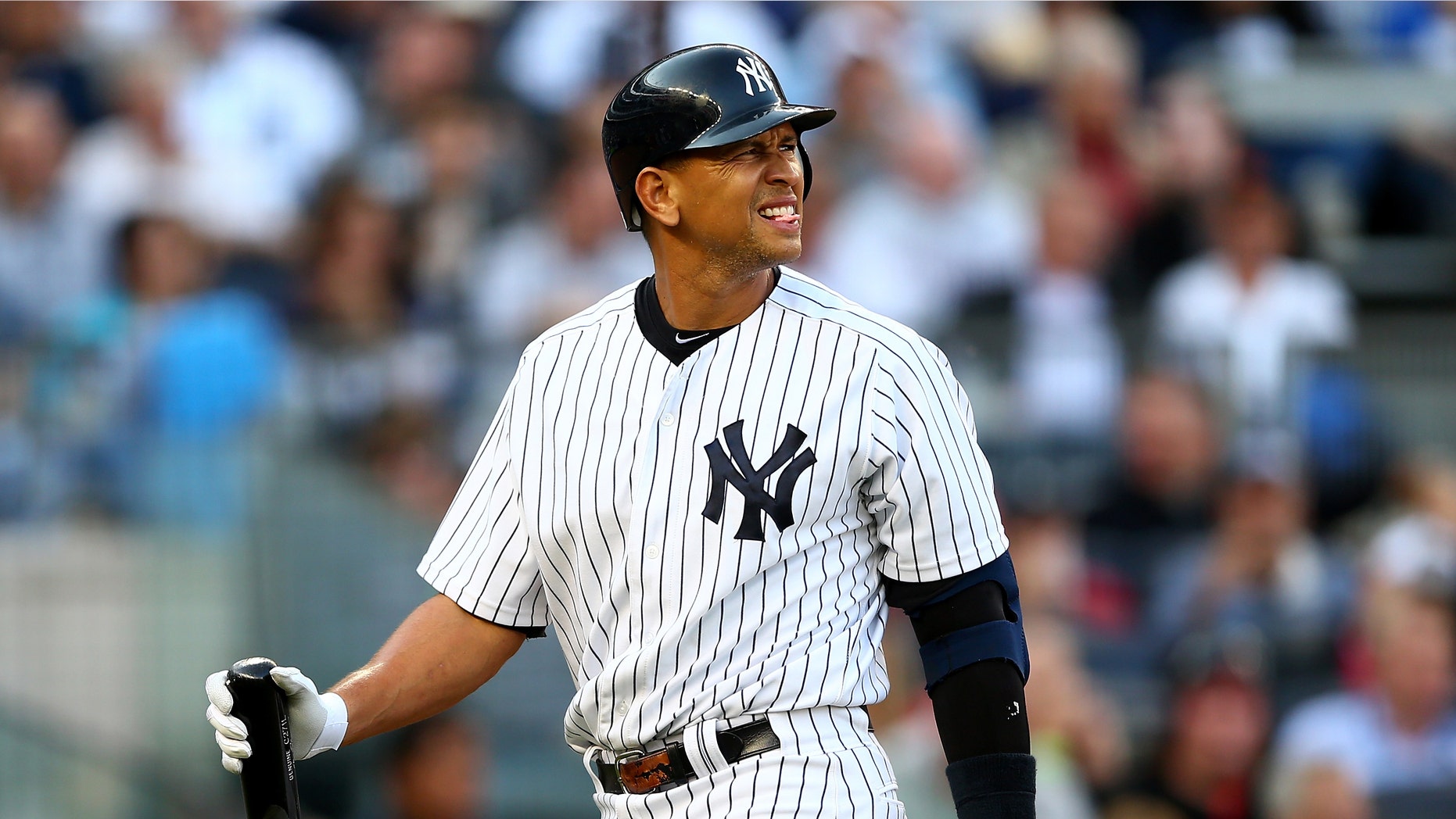 NEW YORK, NY - OCTOBER 14: Alex Rodriguez #13 of the New York Yankees reacts as he walks back to the dugout after he struck out in the bottom of the second inning against the Detroit Tigers during Game Two of the American League Championship Series at Yankee Stadium on October 14, 2012 in the Bronx borough of New York City. (Photo by Elsa/Getty Images)