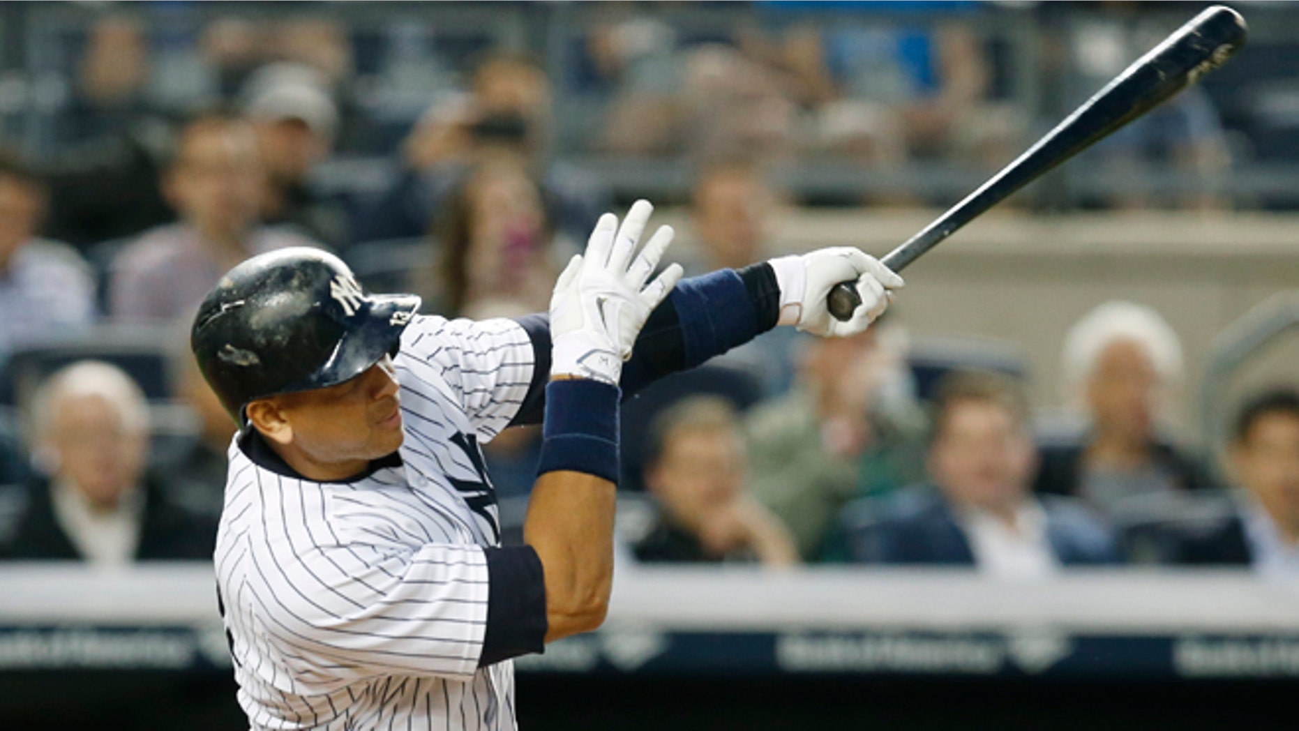 New York Yankees designated hitter Alex Rodriguez hits his 661st home run, surpassing Willie Mays for fourth on baseball's all-time home runs list, in a baseball game against the Baltimore Orioles at Yankee Stadium in New York, Thursday, May 7, 2015. (AP Photo/Kathy Willens)