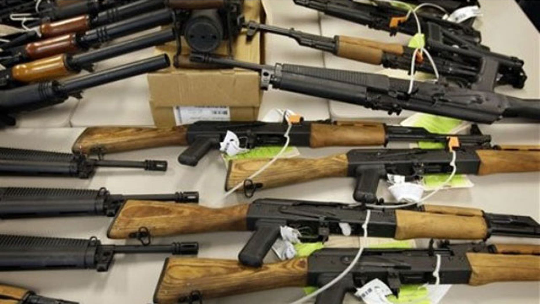 Jan. 25, 2011: A cache of seized weapons used in the ATF gun-running operation 'Fast and Furious' is displayed at a news conference in Phoenix.