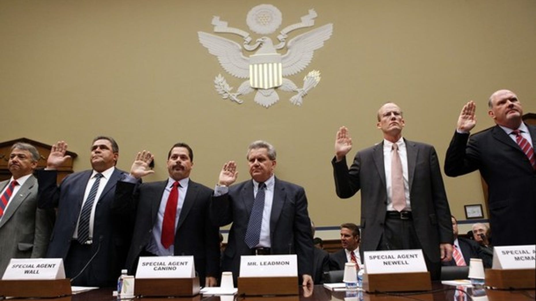 Witnesses are sworn in at a hearing held by the House Oversight and Government Reform Committee on "Operation Fast and Furious: The Other Side of the Border," on Capitol Hill in Washington, July 26, 2011.