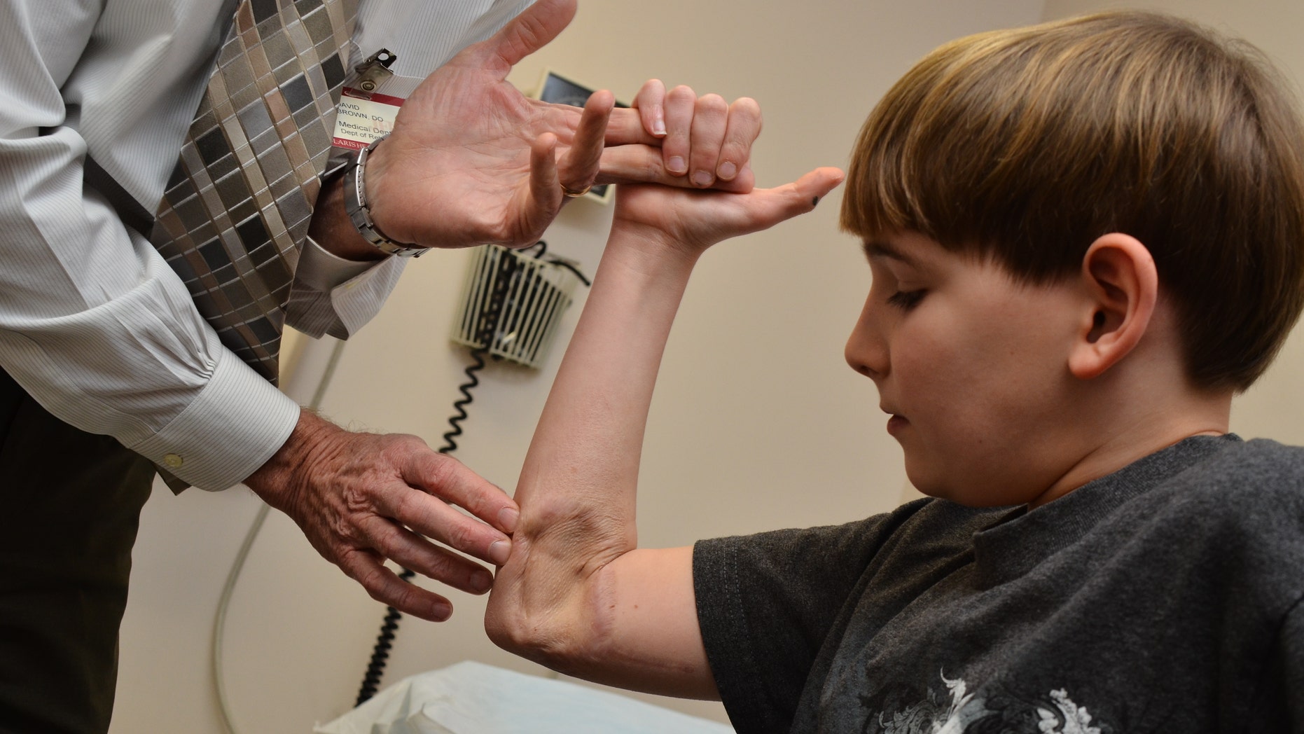 Frankie Davis at a check-up for an injury that washed away 7 cm of nerve from his right arm