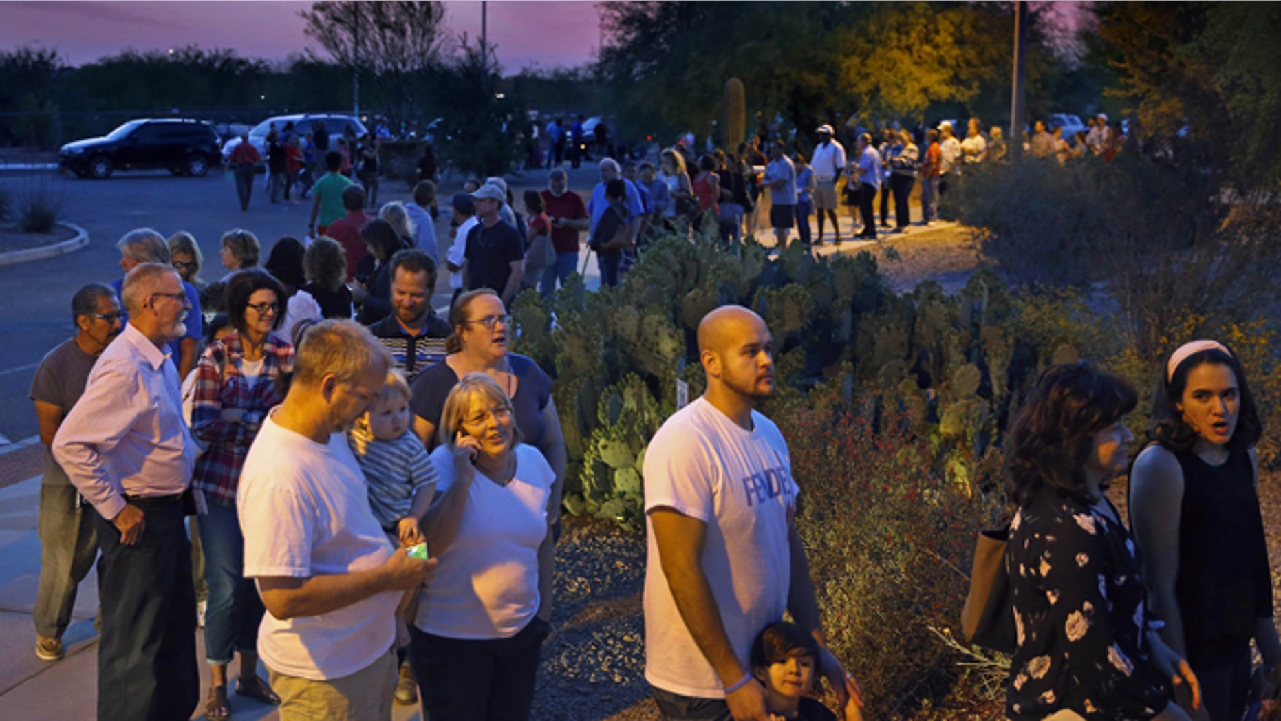 People wait in line to vote in the primary at the Environmental Education Center, Tuesday, March 22, 2016, in Chandler, Ariz. Residents in metro Phoenix have been bristling for years over a perception that state leaders want to make it harder for them to vote, and the mess at the polls Tuesday only heightened the frustration. (David Kadlubowski/The Arizona Republic via AP)