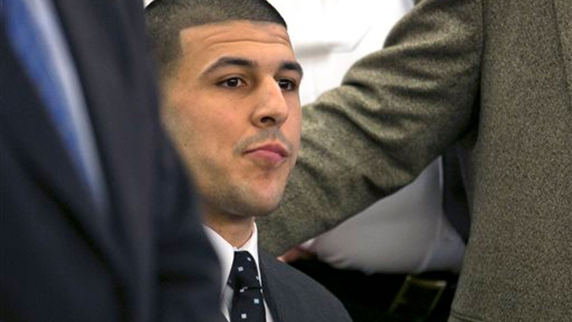 FILE - In this April 15, 2015, file photo, former New England Patriots football player Aaron Hernandez listens as the guilty verdict is read during his murder trial at the Bristol County Superior Court in Fall River, Mass. The Bristol District Attorney's Office said Friday, July 24, 2015, that the investigation and trial cost them nearly a half-million dollars in overtime and expenses. Hernandez was found guilty of first-degree murder in the shooting death of Odin Lloyd in June 2013, and faces a mandatory sentence of life in prison without parole. (Dominick Reuter/Pool Photo via AP, File)