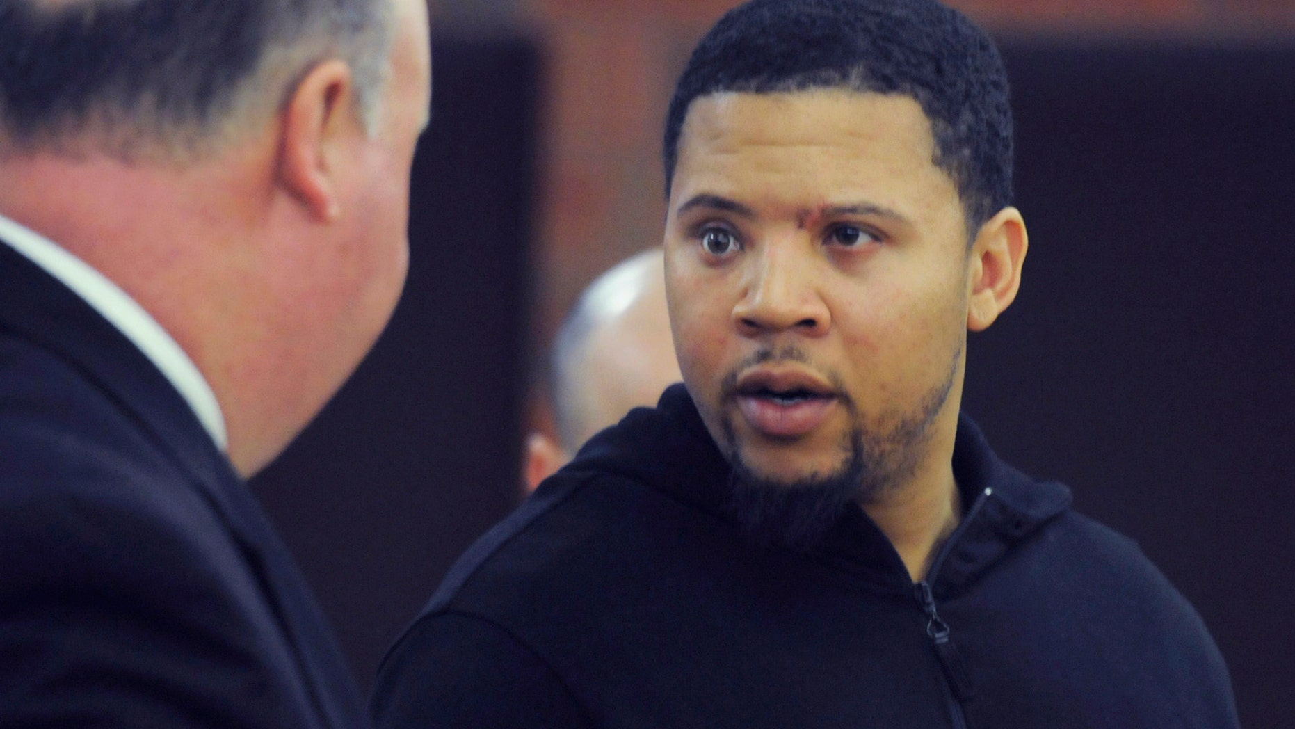 FILE - In this Friday, Oct. 4, 2013, file photo, Alexander Bradley, right, talks with his attorney Robert Pickering, left, during a court appearance at Hartford Superior Court on in Hartford, Conn. Bradley, who alleges he was shot by former New England Patriots tight end Aaron Hernandez, has been shot again in Connecticut. Hartford police Lt. Brian Foley says Bradley was shot several times in the leg Sunday night, Feb. 2, 2014, at the Vevo Lounge Bar & Grill, and was taken to a hospital. His condition hasn't been released. (AP Photo/The Hartford Courant, Richard Messina, Pool, File)
