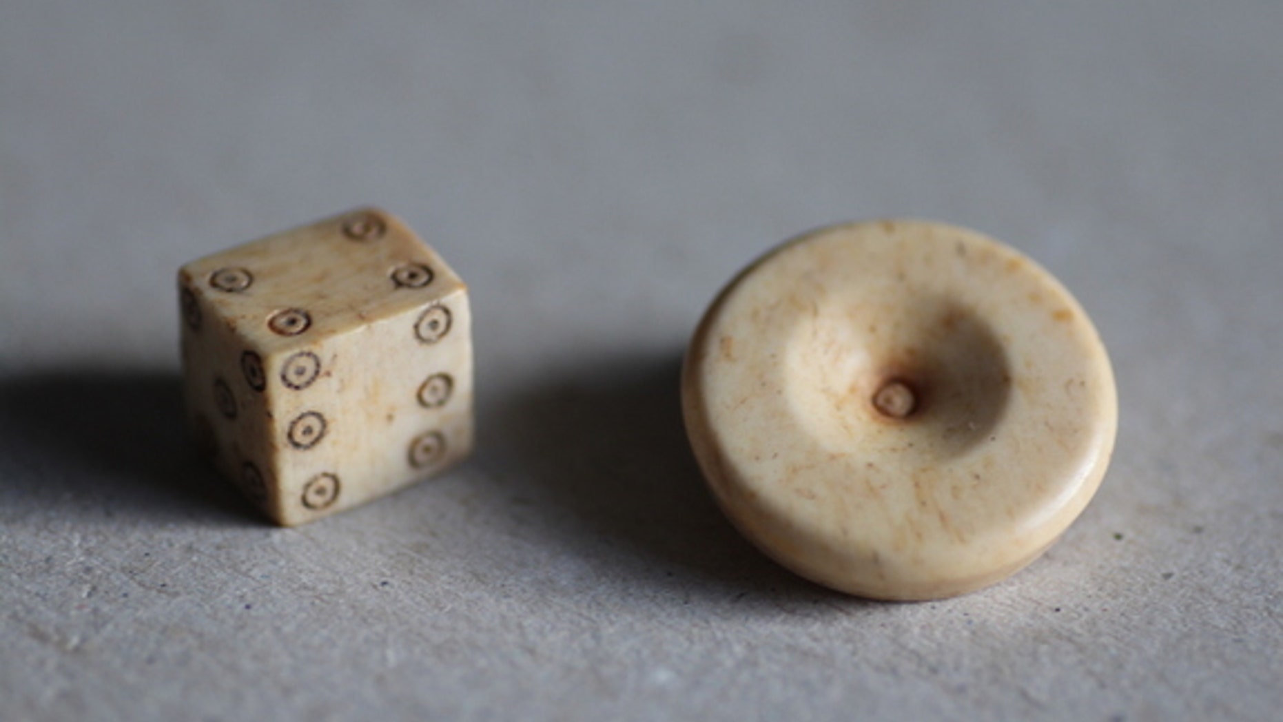 Dice design has changed very little since Roman times. Researchers found a gaming piece and die during excavations of the Roman settlement.