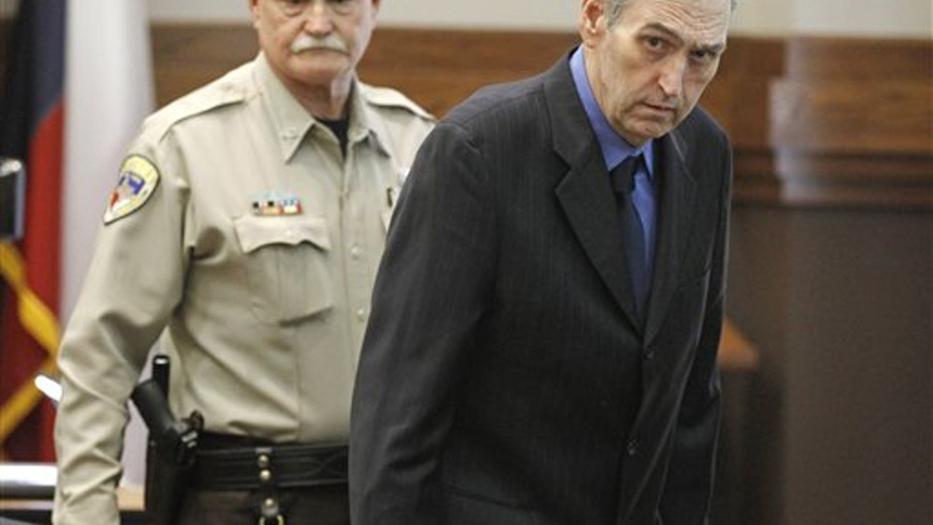 Feb. 14: Jeff Maxwell, right, enters Judge Trey Loftin's Weatherford, Texas courtroom.