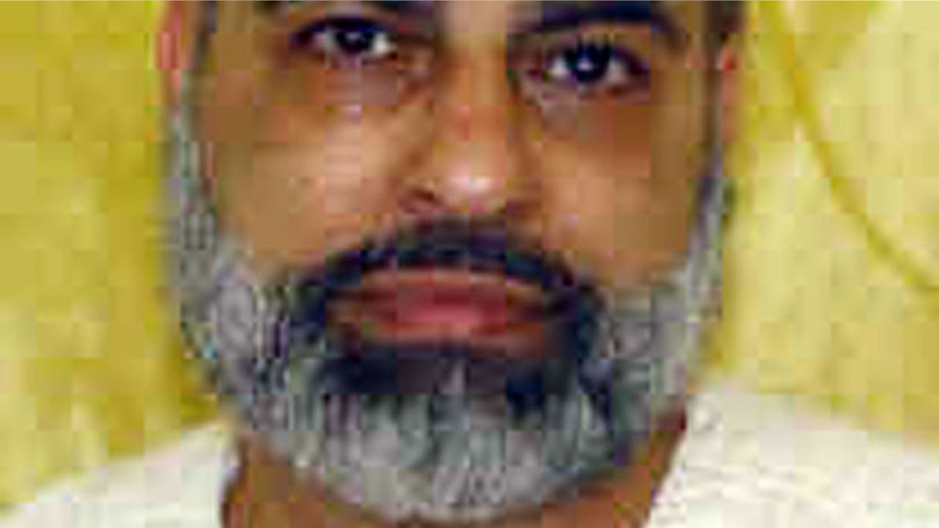 This undated file photo provided by the Ohio Department of Rehabilitation and Correction shows Abdul Awkal, convicted in the 1992 slayings of his estranged wife and brother-in-law at a courthouse in Cleveland's Cuyahoga County.