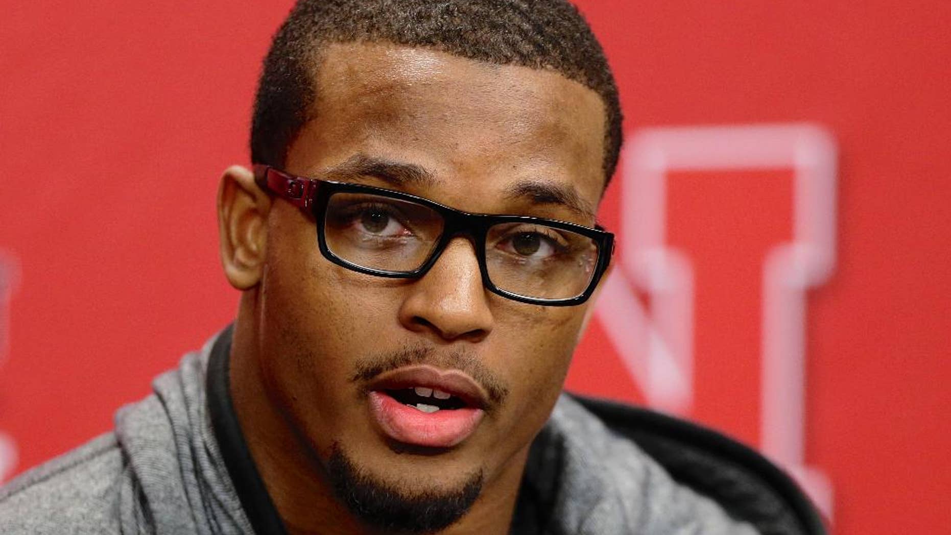 FILE - In this Jan. 16, 2014, file photo, Nebraska running back Ameer Abdullah speaks at a news conference in Lincoln, Neb. Abdullah, a candidate for this year's Heisman Trophy, says 2013 winner Jameis Winston of Florida State needs to clean up his act. Abdullah and Winston are friends from Alabama. (AP Photo/Nati Harnik, File)