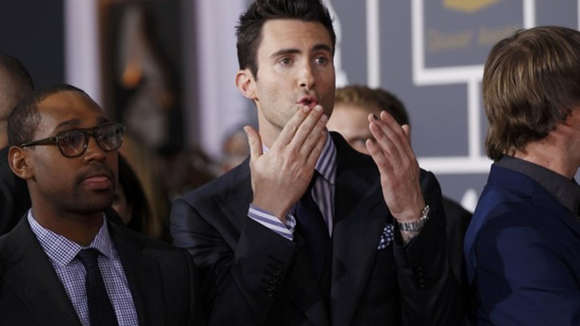 Feb. 12: Singer Adam Levine of Maroon 5 blows kisses to the crowd at the 54th annual Grammy Awards in Los Angeles, California.