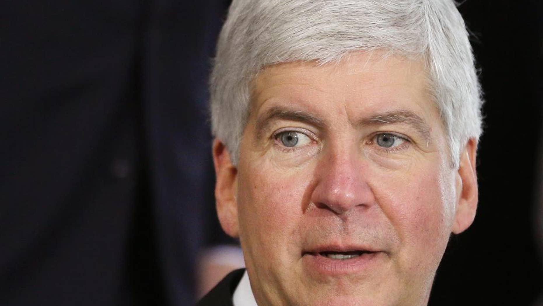 FILE - This June 20, 2014 file photo shows Michigan Gov. Rick Snyder during a ceremony in Detroit. Snyder on Thursday, June 11, 2015 signed a law letting private adoption agencies with state contracts decline to participate in referrals against their religious beliefs, despite criticism that it amounts to government-sanctioned discrimination against gay couples. (AP Photo/Carlos Osorio, file)