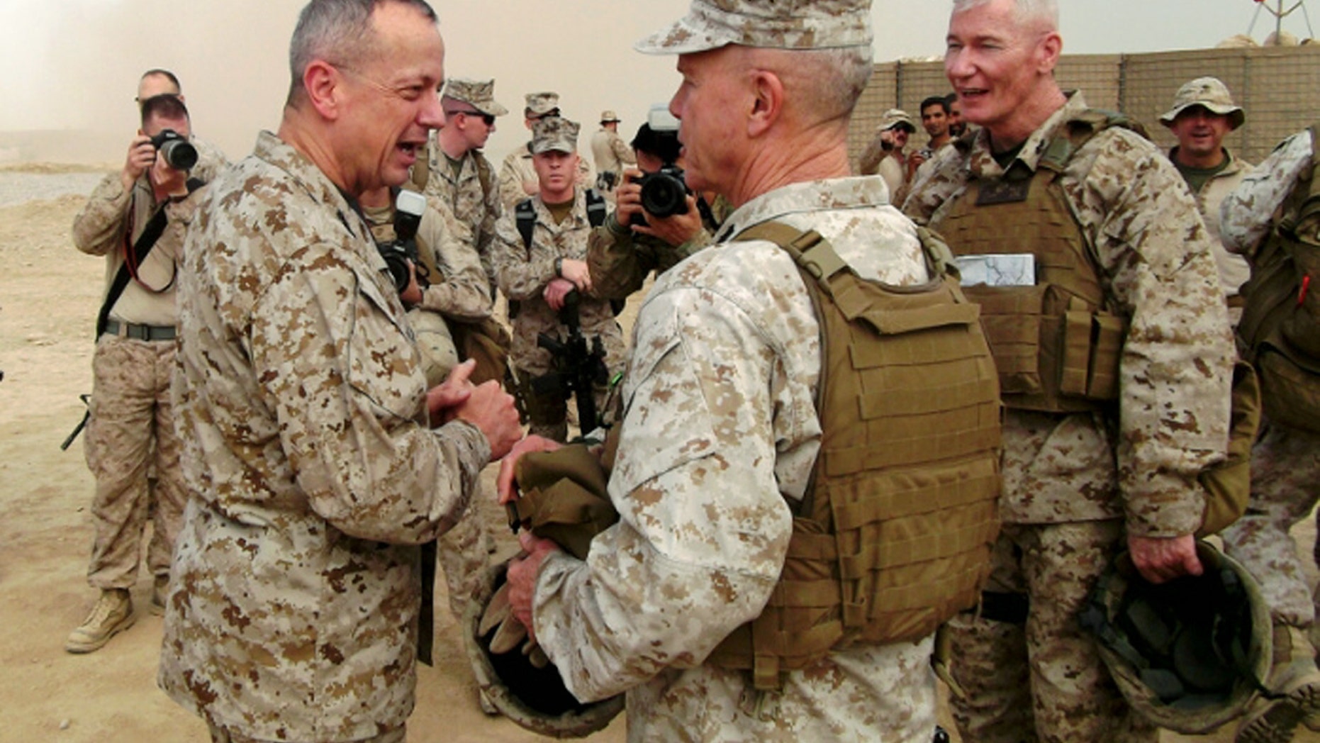 Nov. 23, 2011: Marine Gen. John Allen, left, the top U.S. and NATO commander in Afghanistan, Gen. James Amos, commandant of the Marine Corps, and Marine Maj. Gen. John Toolan, right, the senior U.S. commander in Helmand Province, confer at Combat Outpost Alcatraz.