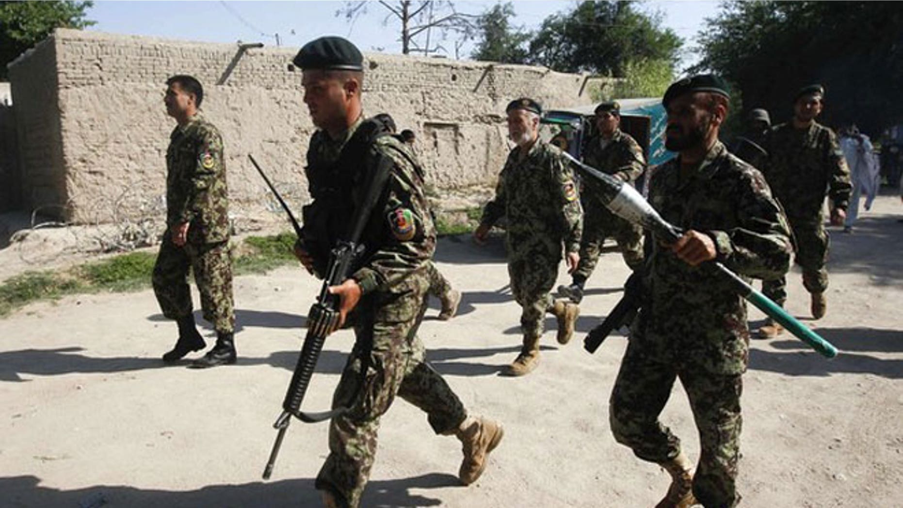 April 15, 2012: Afghan National Army soldiers arrive at the Provincial Reconstruction Team (PRT) after gunmen launched a coordinated attack in Jalalabad province.