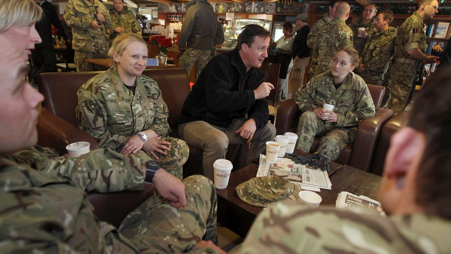 December 20: British Prime Minister David Cameron, center, meets with British soldiers at Kandahar airfield, Afghanistan.