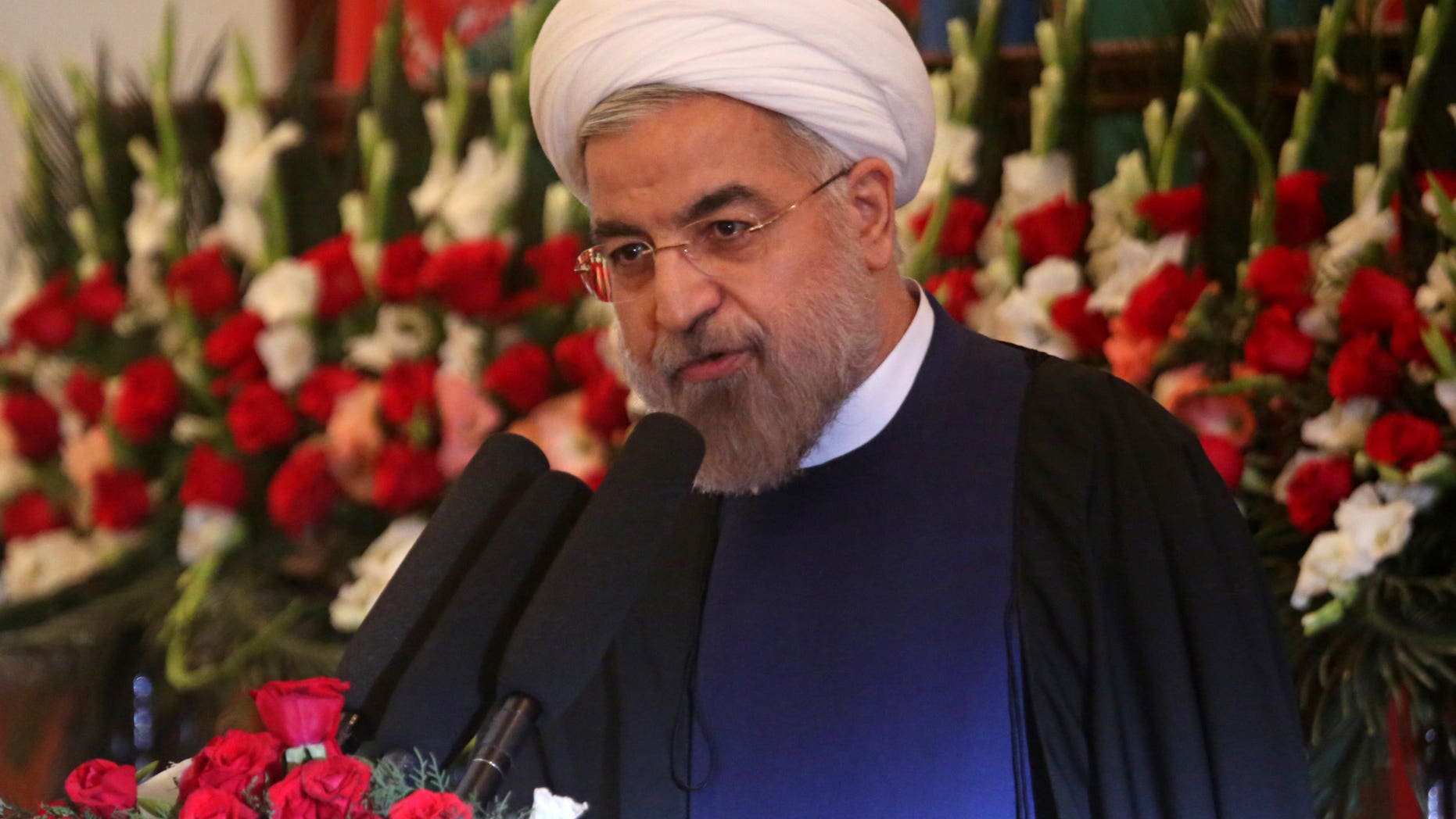 Iranian President Hasan Rouhani speaks during a ceremony celebrating the Persian New Year, Nowruz at the presidential palace in Kabul, Afghanistan, Thursday, March 27, 2014. In his first visit to Afghanistan as Iran's president, Rouhani has called for regional unity while at the same time saying international forces brought "destruction" to Afghanistan. (AP Photo/Massoud Hossaini)
