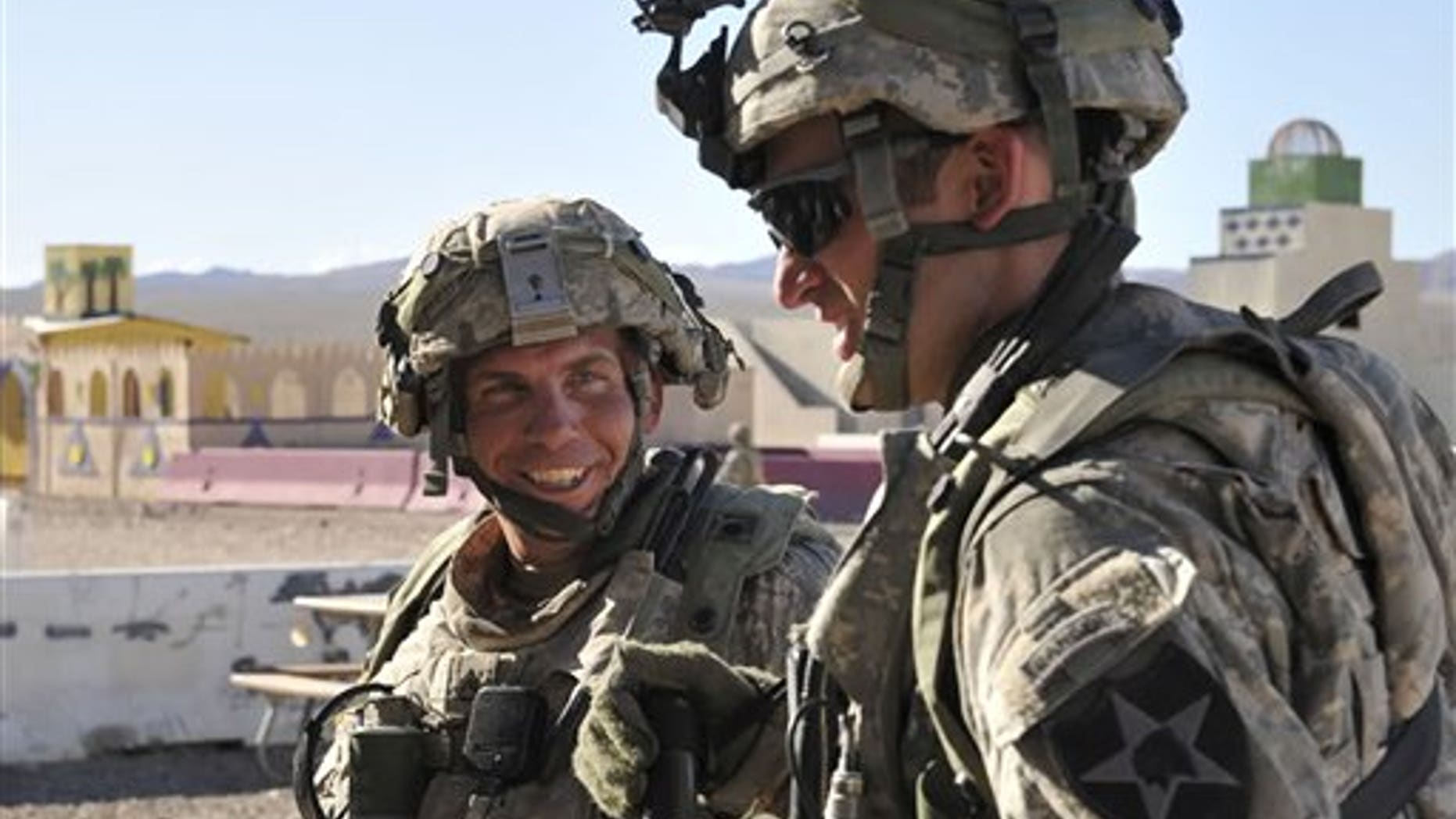 FILE - In this Aug. 23, 2011 Defense Video & Imagery Distribution System photo, soldiers from Blackhorse Company, 2nd Battalion, 3rd Infantry Regiment, 3rd Stryker Brigade Combat Team, 2nd Infantry Division, including Staff Sgt. Robert Bales, left, take part in exercise at the National Training Center at Fort Irwin, Calif.