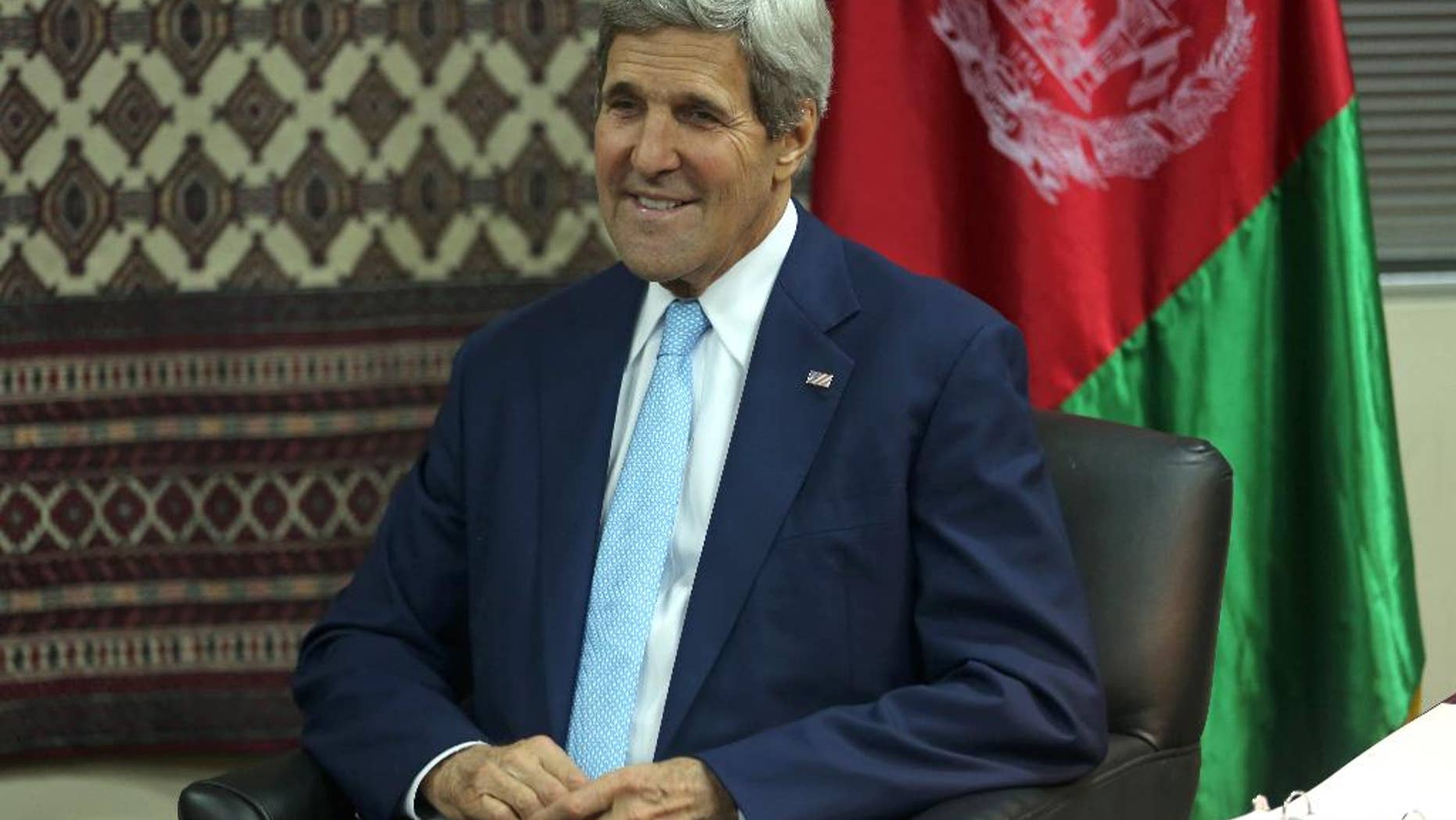 U.S. Secretary of State John Kerry listens during a meeting with Afghanistan's presidential candidate Abdullah Abdullah, during a meeting at U.S. embassy in Kabul, Afghanistan, Thursday, Aug. 7, 2014. (AP Photo/Massoud Hossaini, Pool)