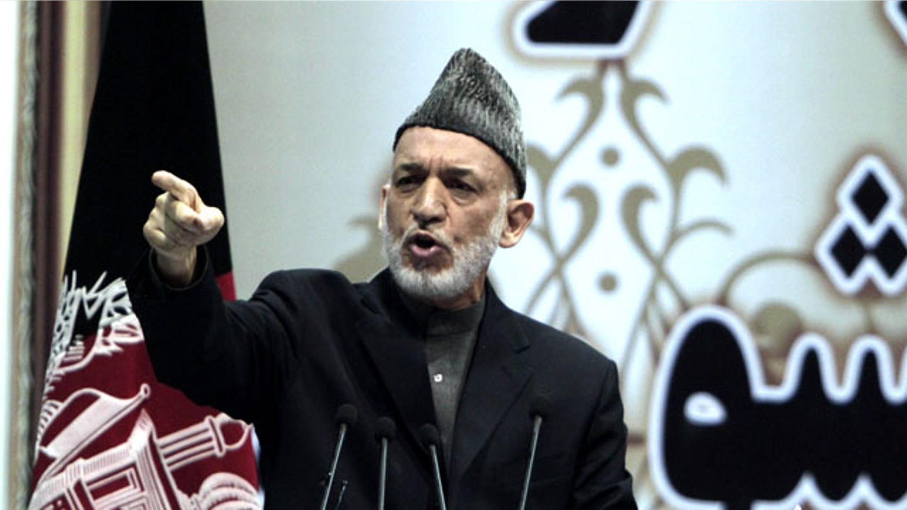 November 24, 2013: Afghan President Hamid Karzai speaks during the last day of the national consultative council known as a Loya Jirga in Kabul, Afghanistan. Afghanistan's president says he won't immediately sign a security deal with the United States, ignoring a recommendation by an assembly of Afghan elders and leaders that he do so by the end of the year. (AP Photo/Rahmat Gul)
