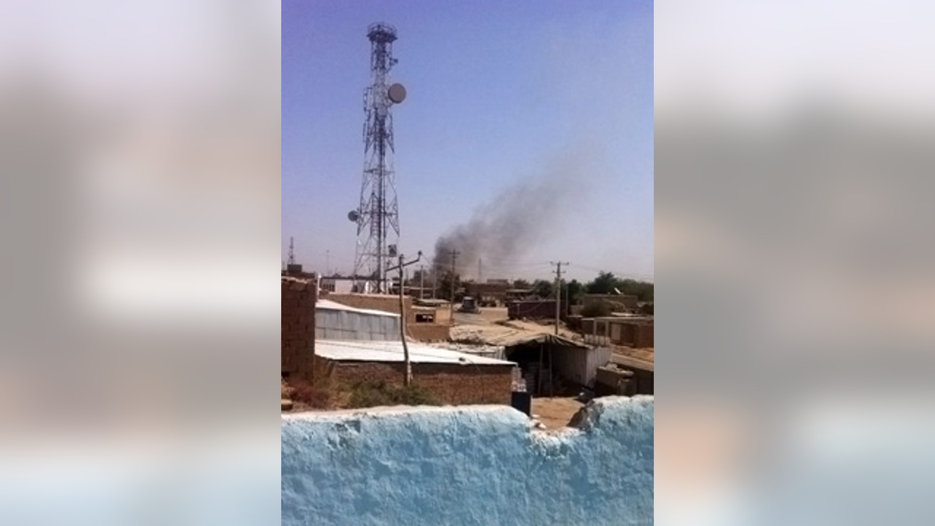 Sept. 28, 2015: Smoke rises from a police station during clashes between Taliban fighters and Afghan security forces, in Kunduz city, north of Kabul. (AP Photo)