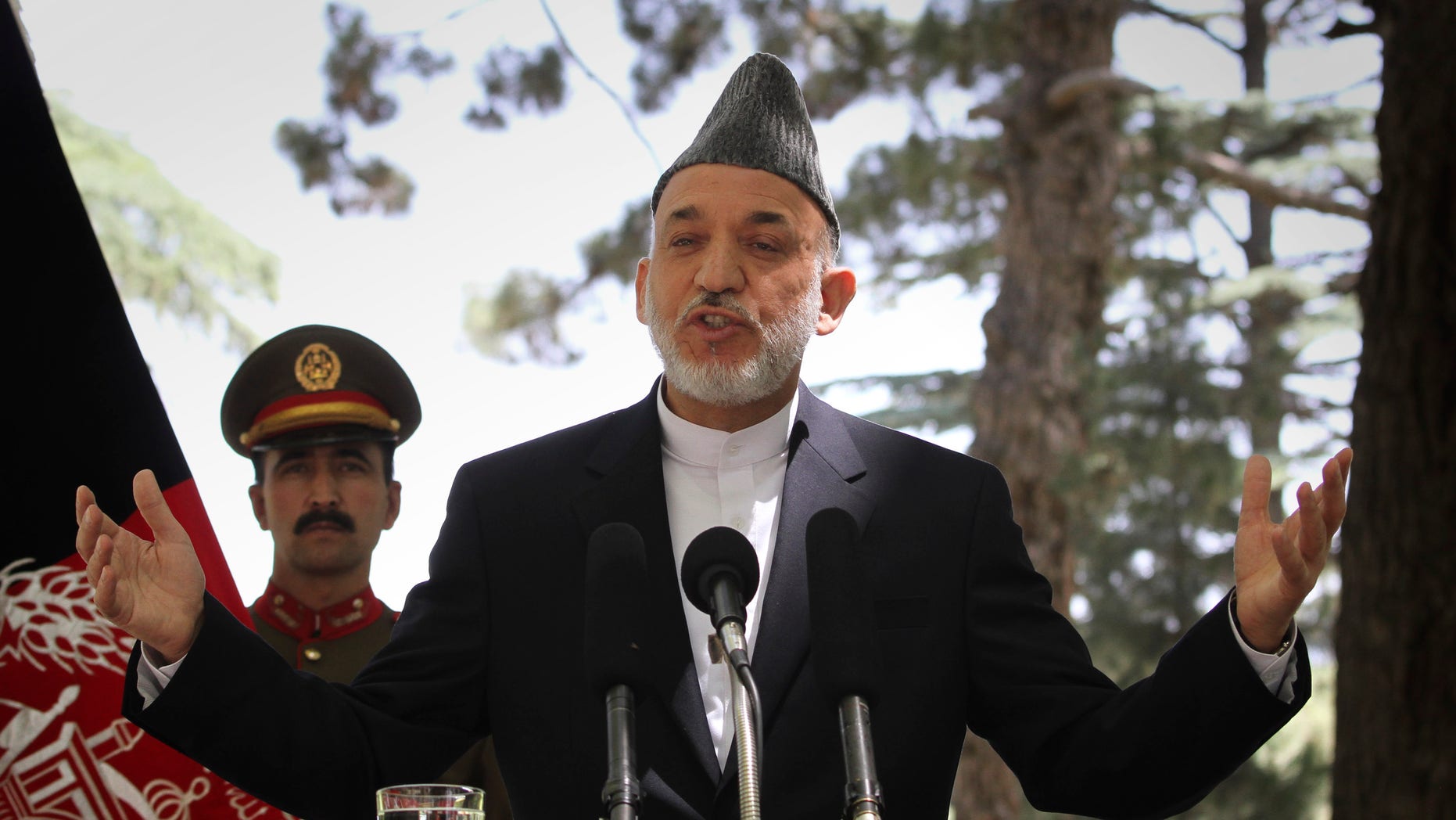 May 31: Afghan President Hamid Karzai gestures during a press conference at the presidential palace in Kabul, Afghanistan. Angered by civilian casualties, Karzai said Tuesday he will no longer allow NATO airstrikes on houses, issuing his strongest statement yet against strikes that the military alliance says are key to its war on Taliban insurgents. (AP)