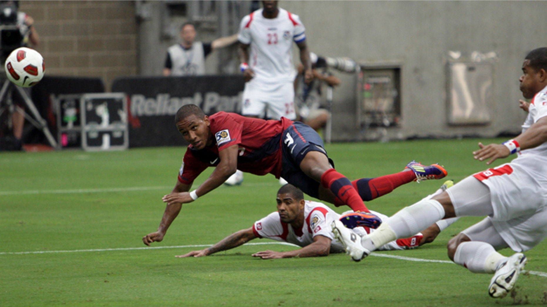 HOUSTON - JUNE 22: Juan Agudelo #9 of the U.S.A. puts a header on goal in the first half as Roman Torres #5 of Panama is late defending on the play in the first half at Reliant Stadium on June 22, 2011 in Houston, Texas. (Photo by Bob Levey/Getty Images)