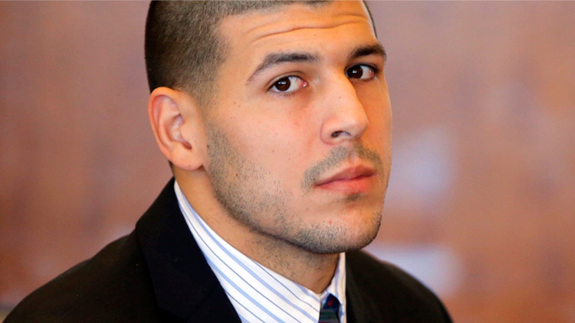 FILE 2013: Former New England Patriots NFL football player Aaron Hernandez attends a pretrial court hearing in Fall River, Mass. Hernandez is set to be arraigned on murder charges for allegedly ambushing and gunning down two men in 2012 after a chance encounter inside a Boston nightclub.