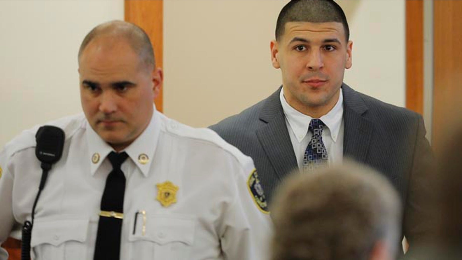 JUNE 2013: Former New England Patriots football player Aaron Hernandez arrives in the courtroom at Bristol County Superior Court in Fall River, Massachusetts.