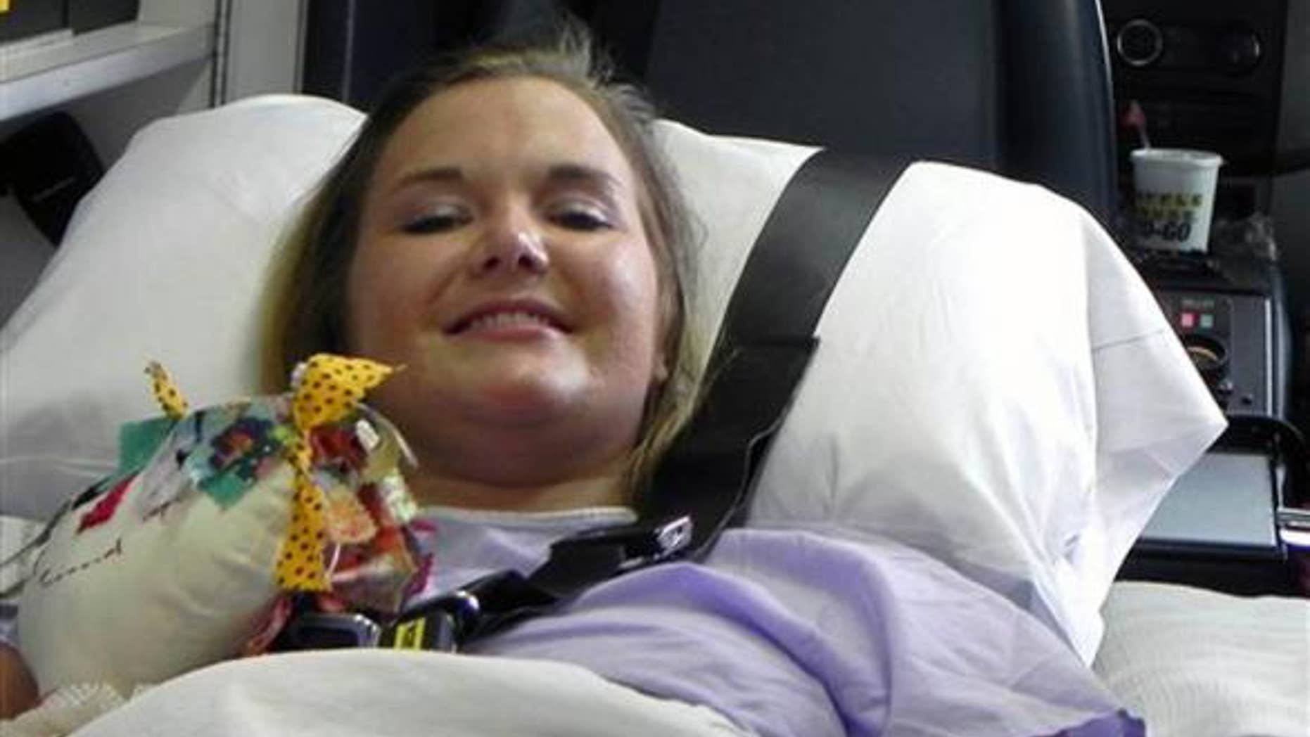 Aimee Copeland smiles as she leaves a hospital in Augusta Ga., July 2, headed for an inpatient rehabilitation clinic.