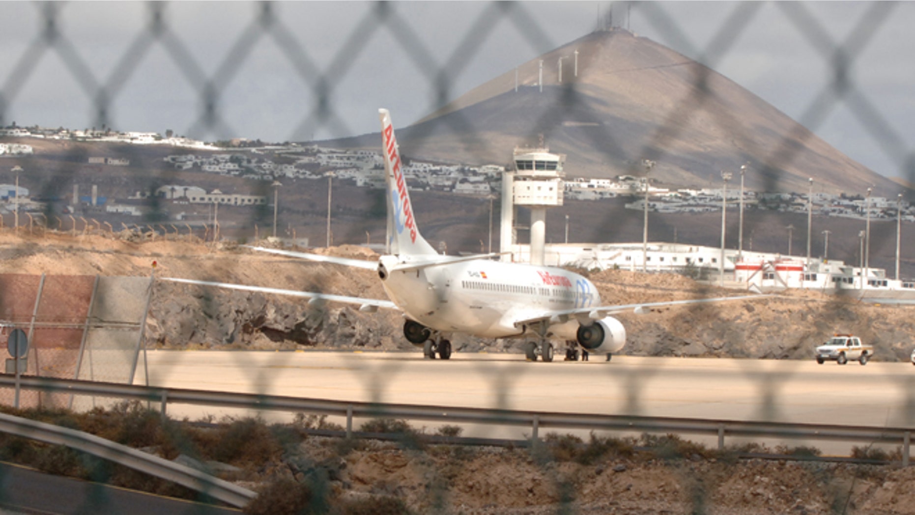 LANZAROTE, SPAIN - OCTOBER: An Air Europa Boeing-737 sits parked at the end of the runway on October 31, 2008 at Lanzarote airport in the Canary Islands, Spain. The flight chartered by Thomas Cook arriving from Glasgow at 7.10 this morning experienced problems with it's undercarriage and skidded off the runway as it came in to land. No one was hurt and it is thought weather was to blame for destabilising it's landing (Photo by Torsten Laursen/Getty Images)
