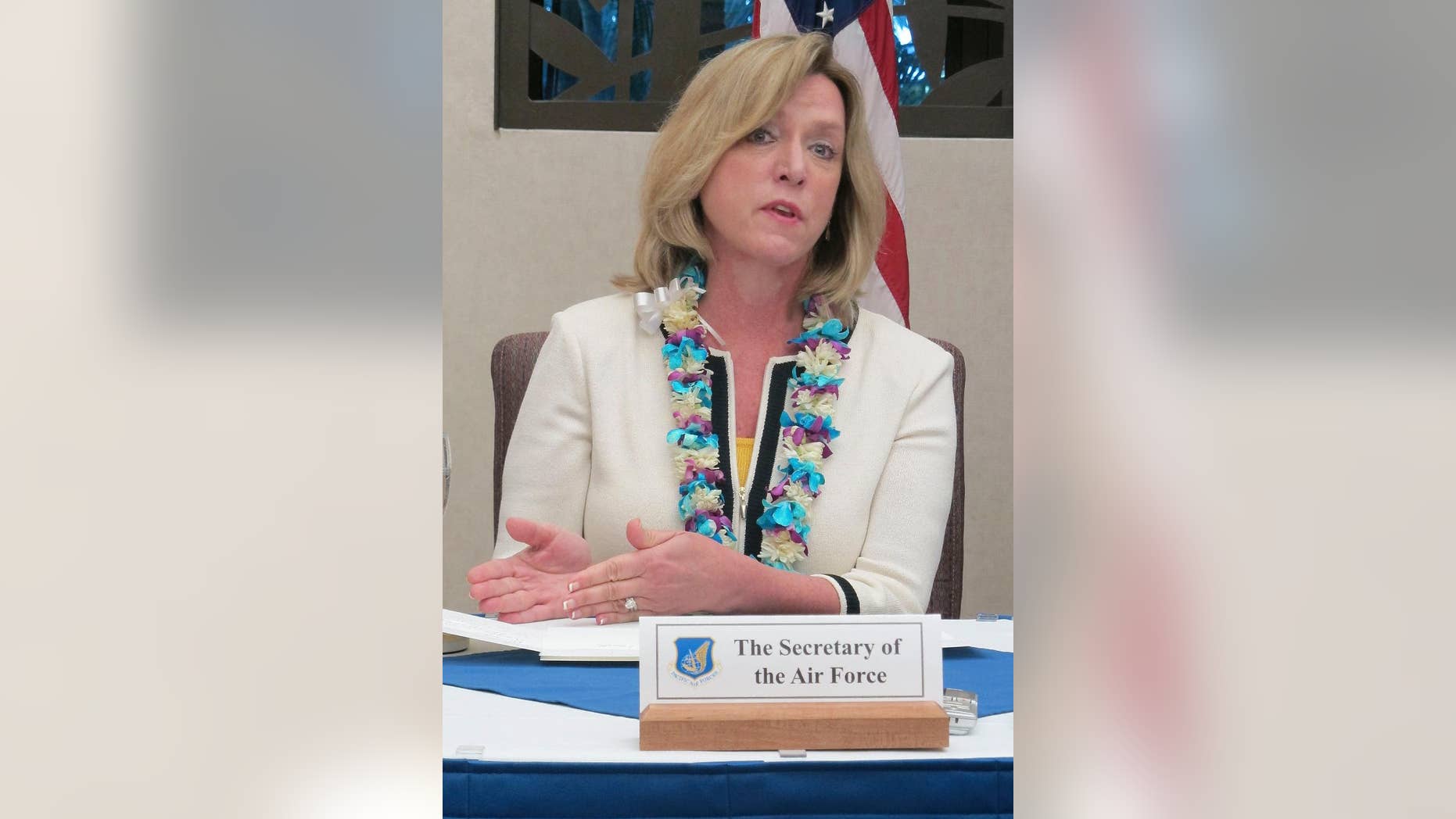 Air Force Secretary Deborah Lee James speaks to reporters at Joint Base Pearl Harbor-Hickam in Hawaii on Monday, Nov. 17, 2014. James said she hopes to make all jobs in the service open to qualified women in the next year and a half. (AP Photo/Audrey McAvoy)