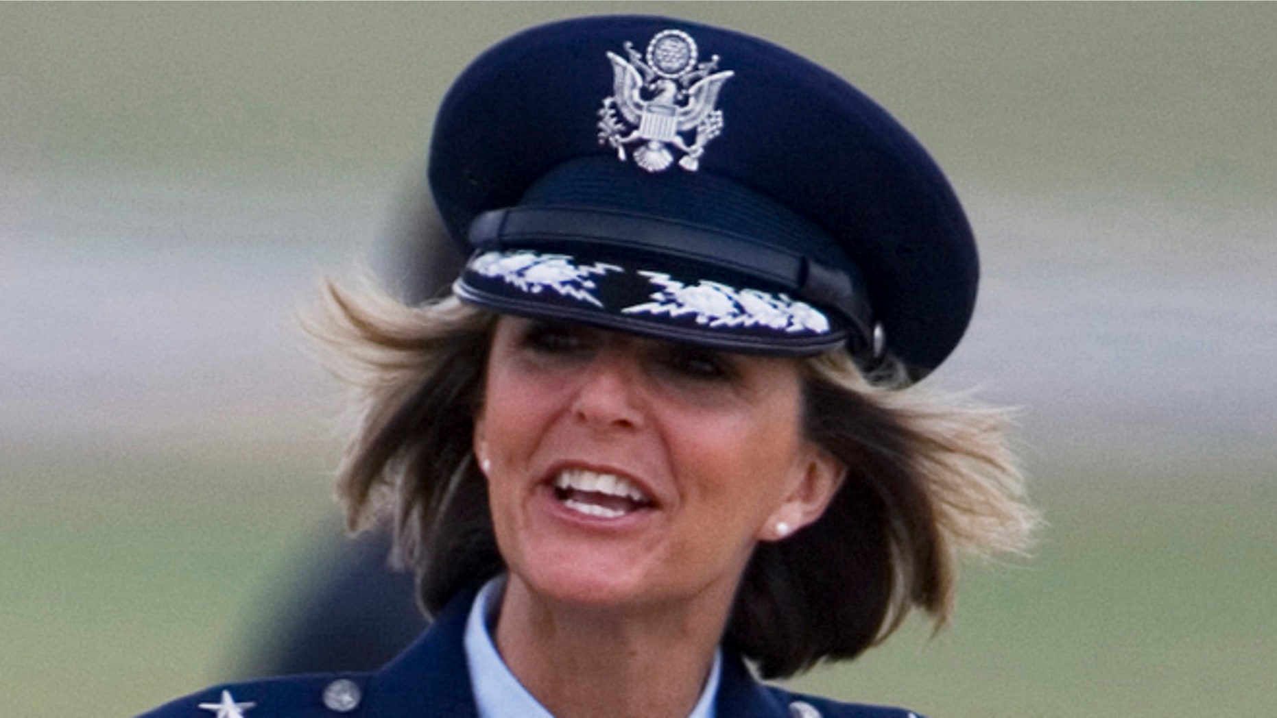 Aug. 4, 2008: In this file photo, Brig. Gen. Margaret Woodward, the 389th Airlift Wing Commander, waves on the tarmac of Andrews Air Force Base in Maryland.