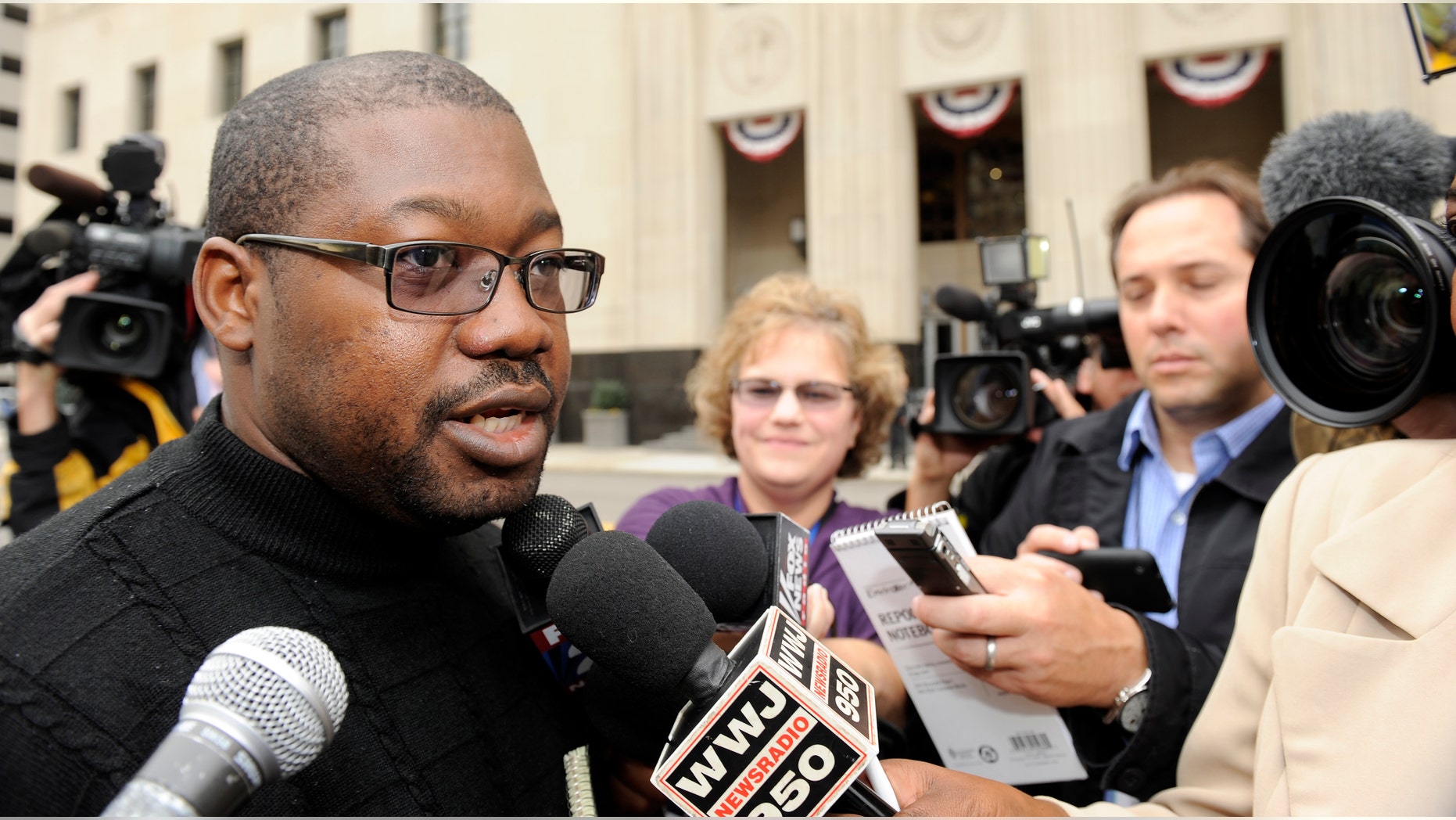 October 12: Alain Ghonda, a passanger on the Amsterdam-to-Detroit flight, speaks outside federal court in Detroit. Accused "underwear bomber" Umar Farouk Abdulmutallab surprised the federal courtroom during the second day of his terrorism trial Wednesday by pleading guilty to all charges.