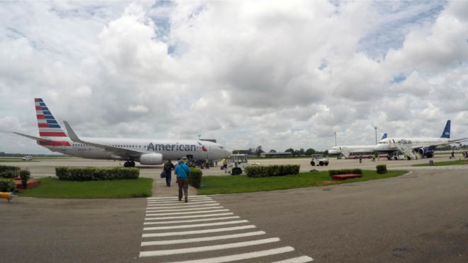 In this Friday, June 10, 2016, photo, American Airlines and JetBlue Airways charter flights wait to depart from Havanaââ¬â¢s Jose Marti International Airport. The Department of Transportation said Friday that six airlines: American, Frontier, JetBlue, Silver Airways, Southwest and Sun Country, have been selected for routes to nine Cuban cities other than Havana. (AP Photo/Scott Mayerowitz)