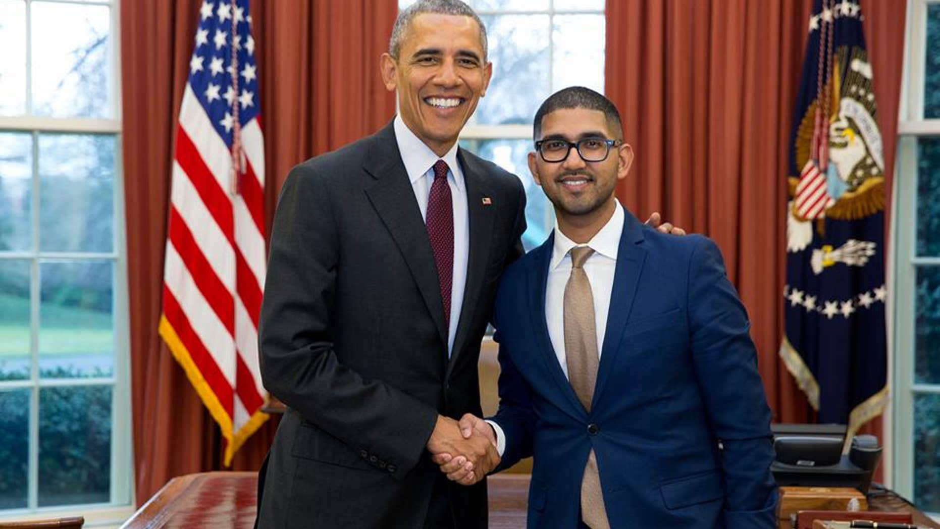 In an undated photo, Vikrum Aiyer, then chief of staff of the U.S. Patent and Trademark Office, poses with President Barack Obama.