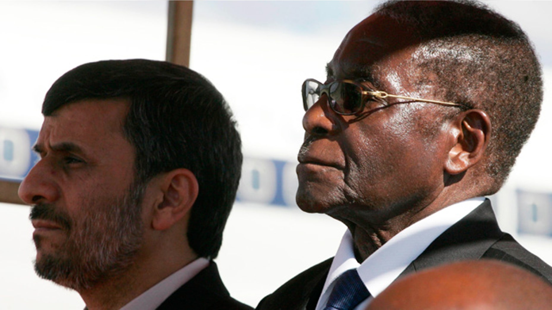 April 22: Robert Mugabe and Mahmoud Ahmadinejad pictured together at Harare Airport.