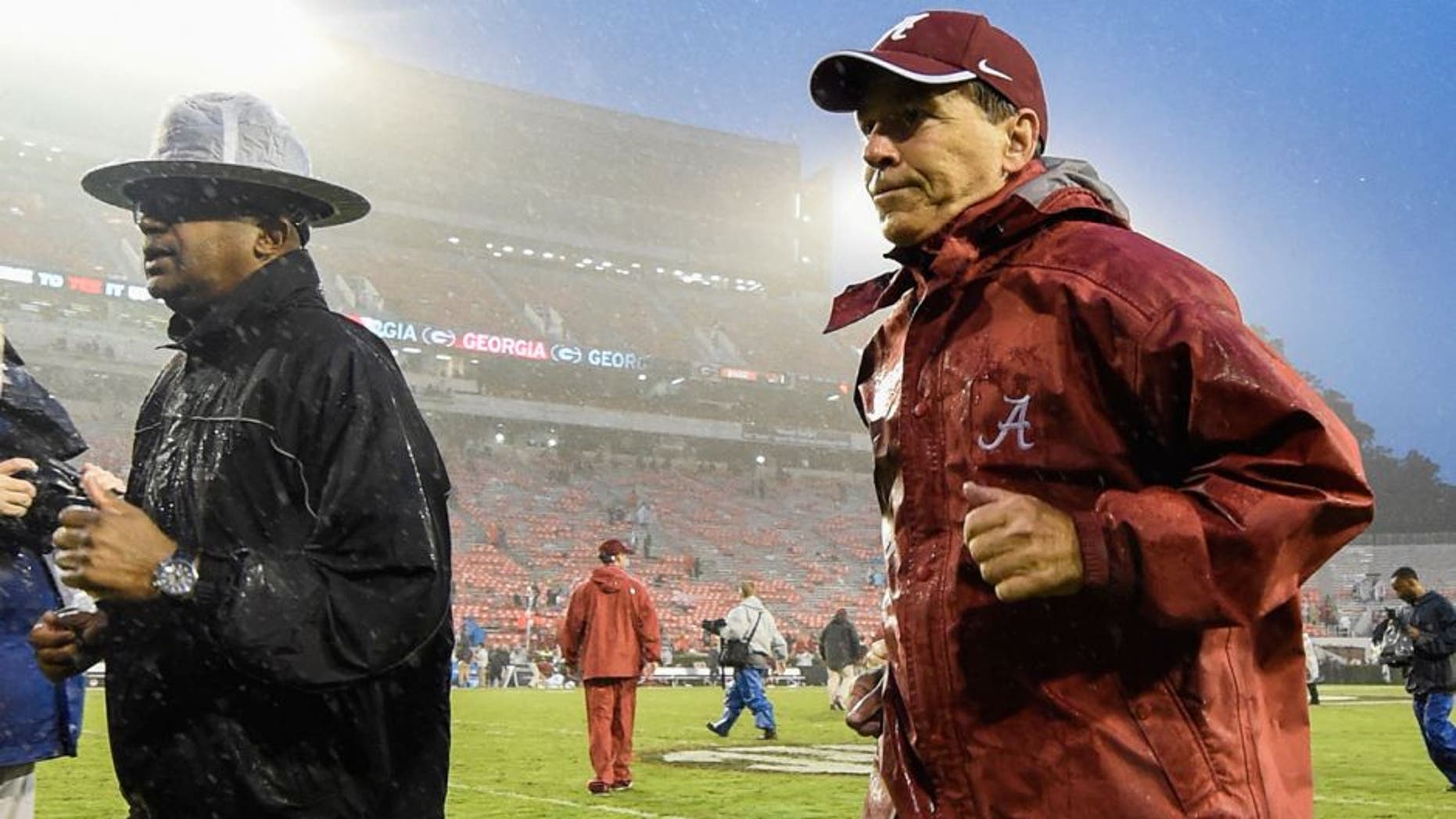 Oct 3, 2015; Athens, GA, USA; Alabama Crimson Tide head coach Nick Saban runs off the field after the game against the Georgia Bulldogs at Sanford Stadium. Alabama defeated Georgia 38-10. Mandatory Credit: John David Mercer-USA TODAY Sports