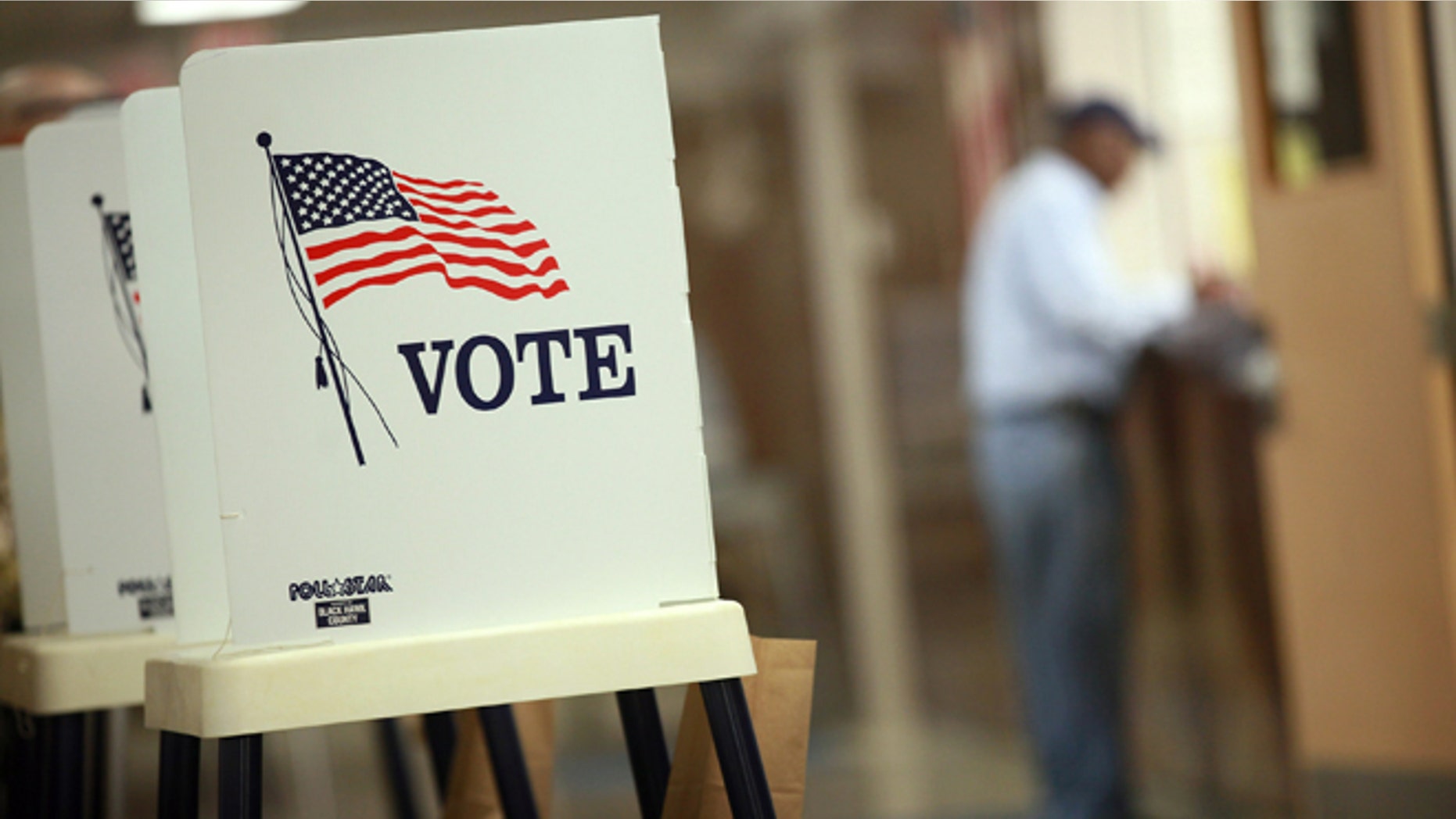 WATERLOO, IA - SEPTEMBER 27: Voting booths are set up for early voting at the Black Hawk County Courthouse on September 27, 2012 in Waterloo, Iowa. Early voting starts today in Iowa where in the 2008 election 36 percent of voters cast an early ballot. (Photo by Scott Olson/Getty Images)