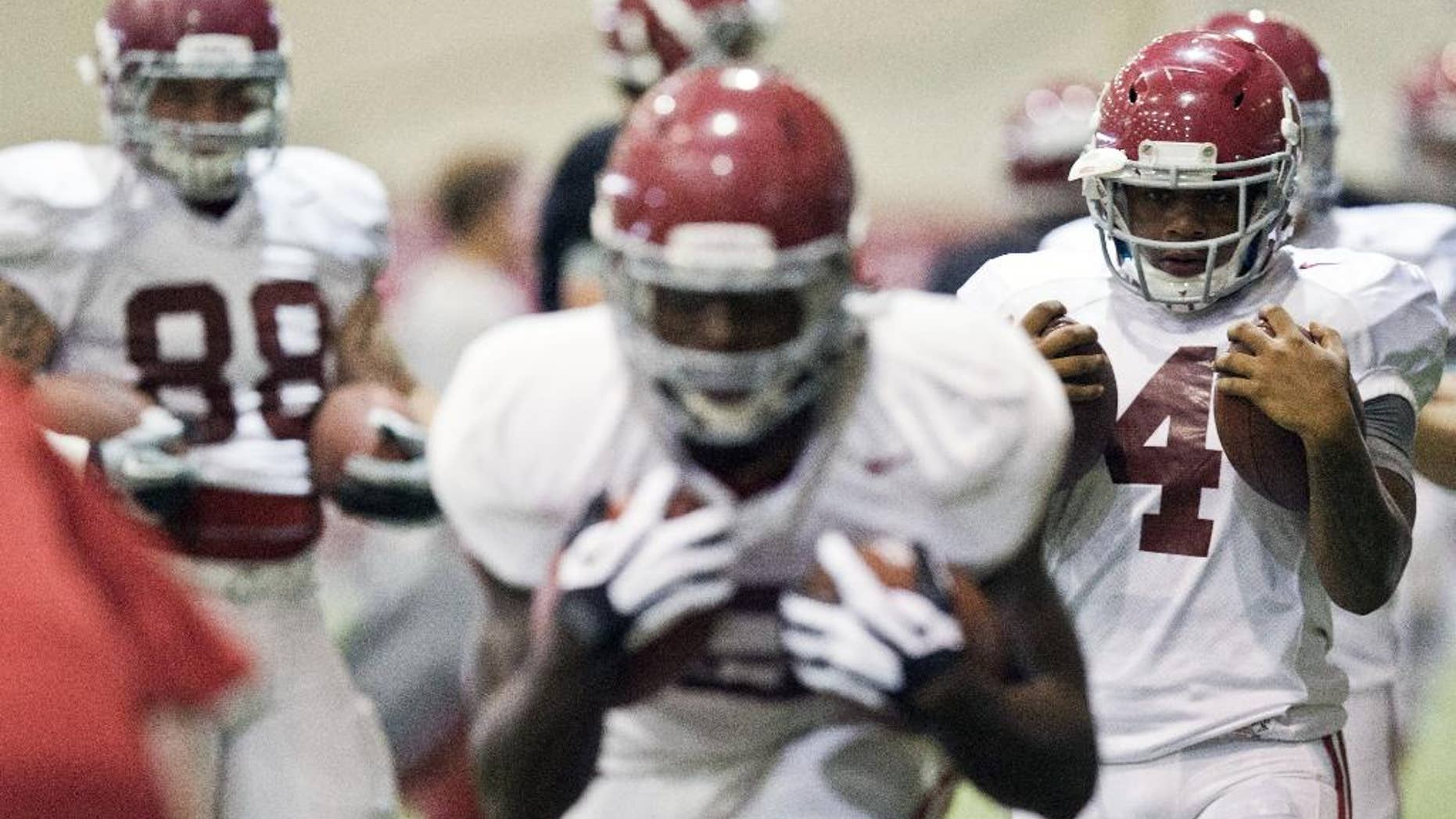 Alabama running back T.J. Yeldon (4) prepares for running drills during an NCAA college football practice at Hank Crisp indoor practice facility on Monday, Aug. 25, 2014, in Tuscaloosa, Ala. (AP Photo/Brynn Anderson)