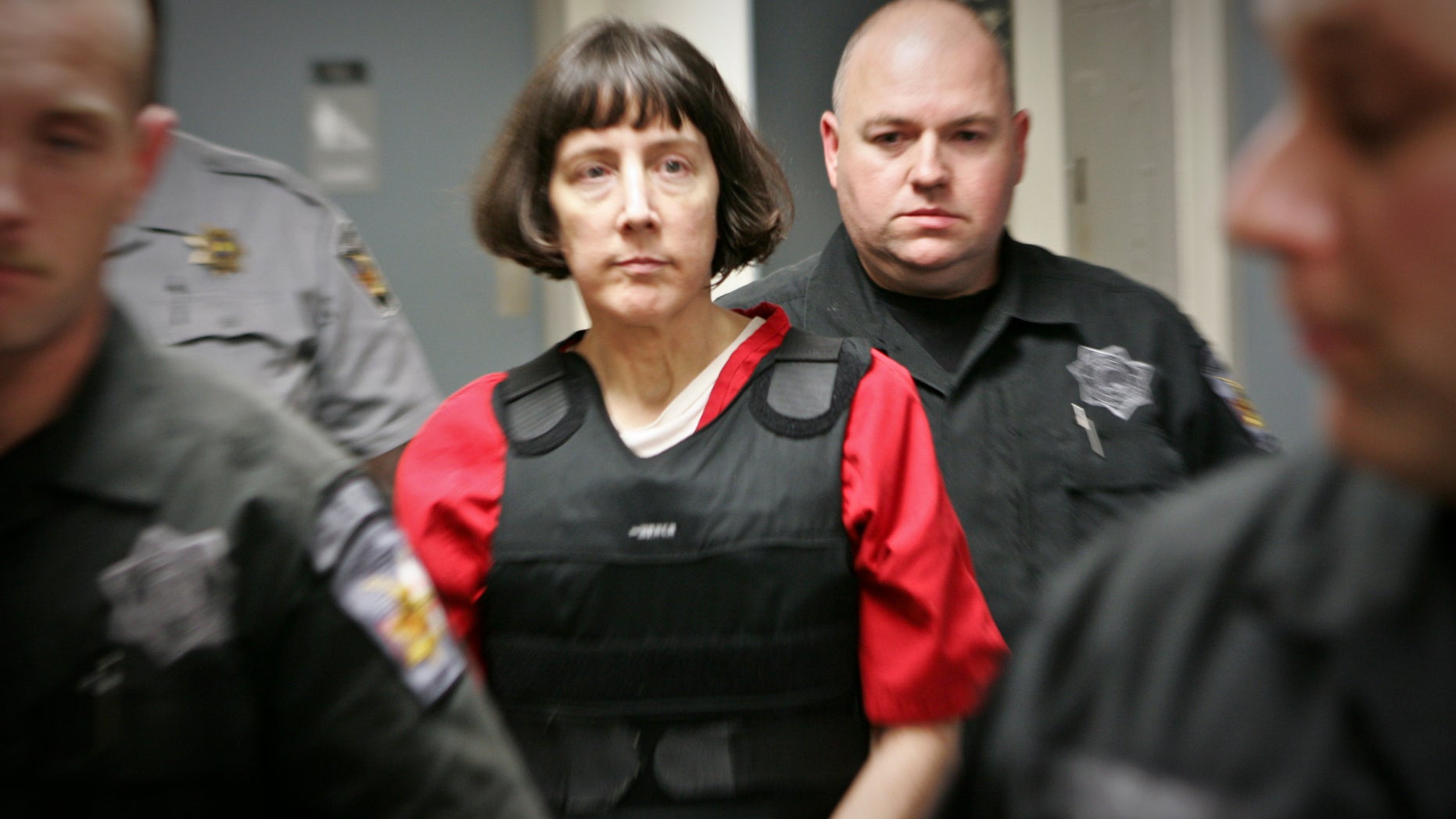 Sept. 11, 2012: Amy Bishop is escorted by sheriff's deputies at the Madison County Courthouse in Hunstville, Ala.