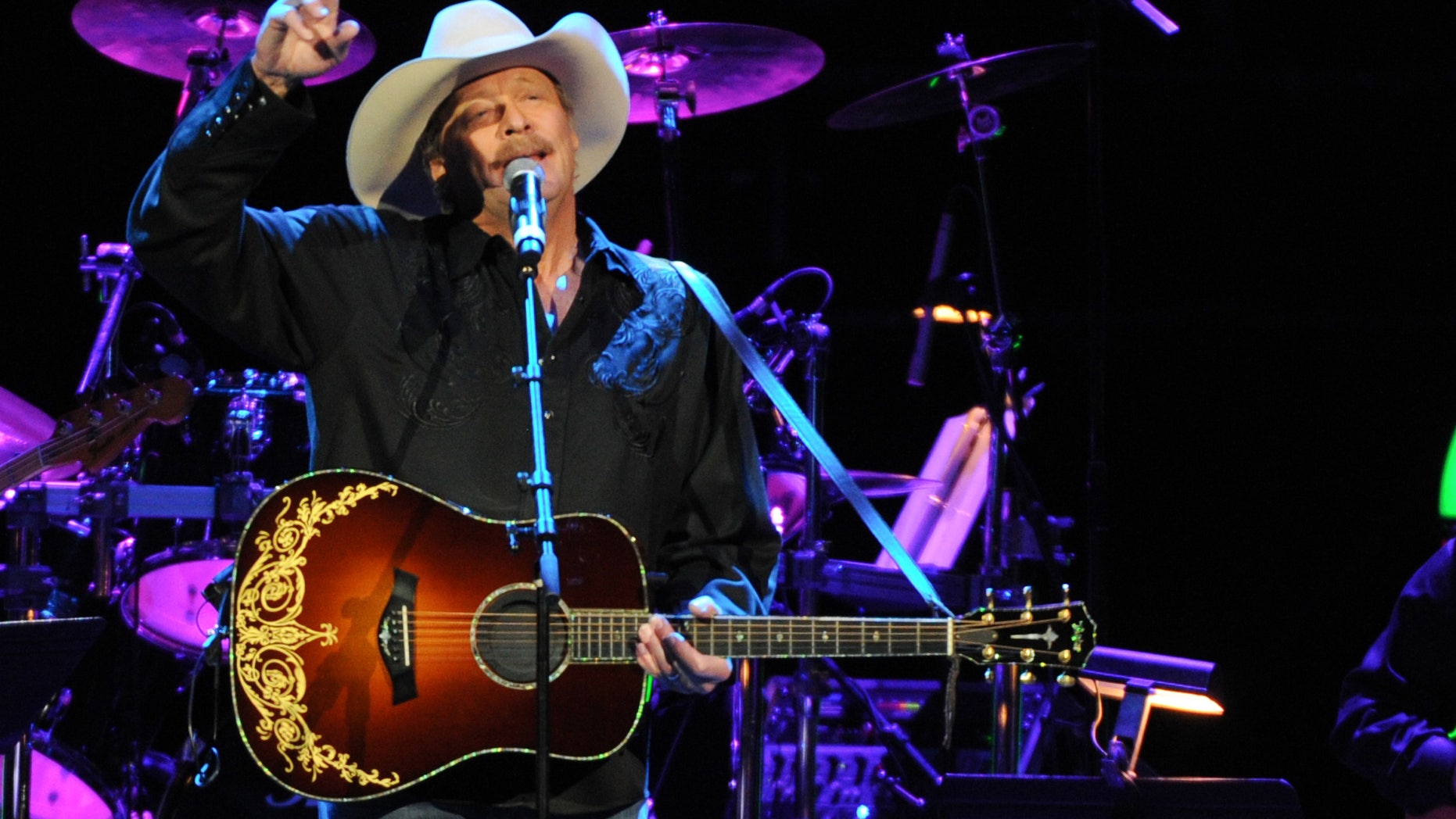 November 22, 2013. Alan Jackson performs at the George Jones Tribute - Playin' Possum: The Final No Show at the Bridgestone Arena in Nashville, Tenn.