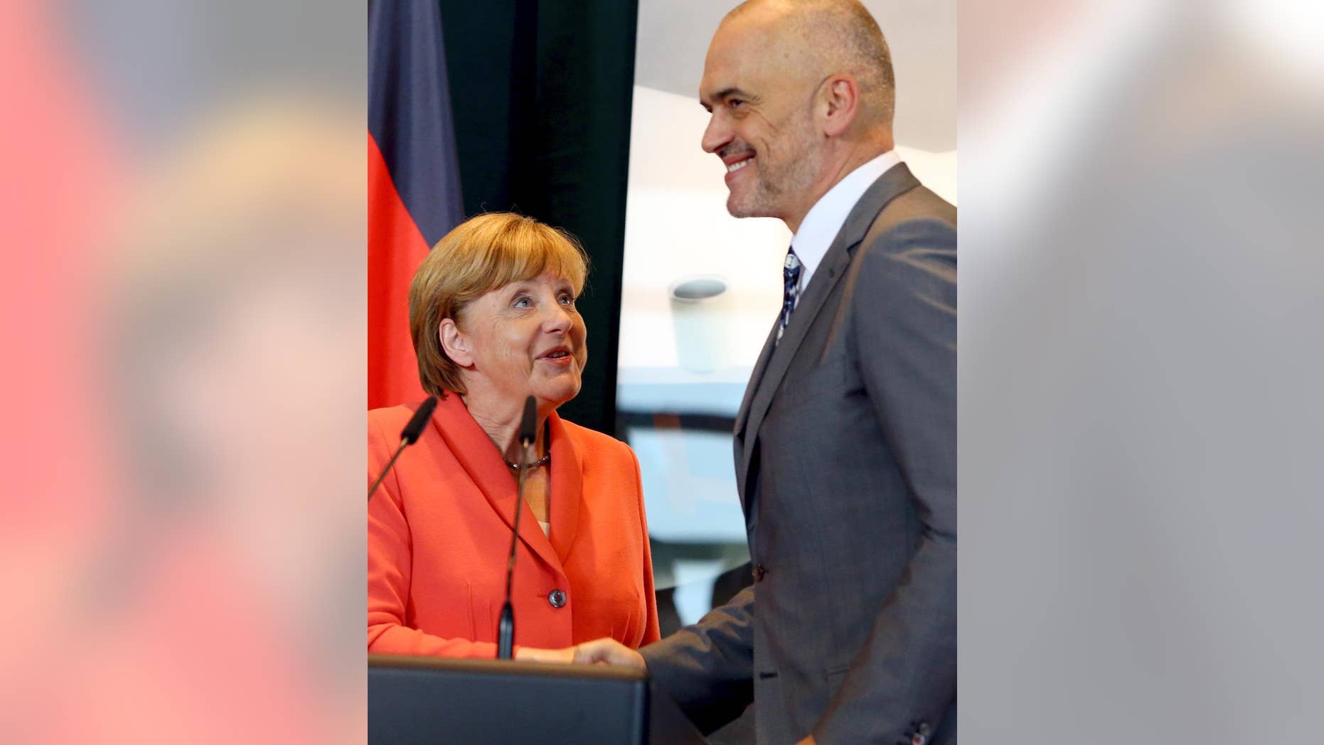 Visiting German Chancellor Angela Merkel and her host Albanian counterpart Edi Rama attend a news conference on the first stop of her Balkan tour in Tirana on Wednesday, July 8, 2015.