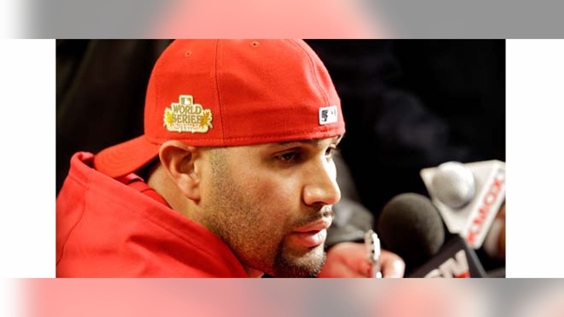 ST LOUIS, MO - OCTOBER 18: Albert Pujols #5 of the St. Louis Cardinals speaks to the media during a news conference at Busch Stadium on October 18, 2011 in St Louis, Missouri. The Texas Rangers will take on the St. Louis Cardinals in Game One of the 2011 World Series on October 19. (Photo by Rob Carr/Getty Images)