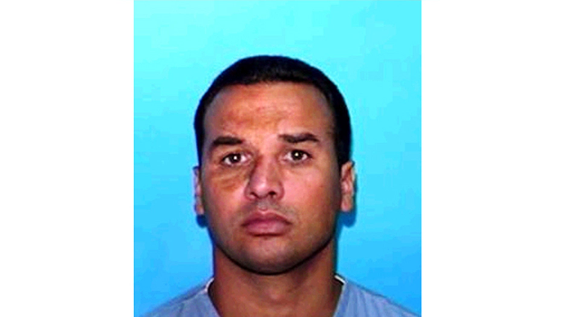 This undated handout photo provided by the Grapevine Police Department shows Alberto Morales.