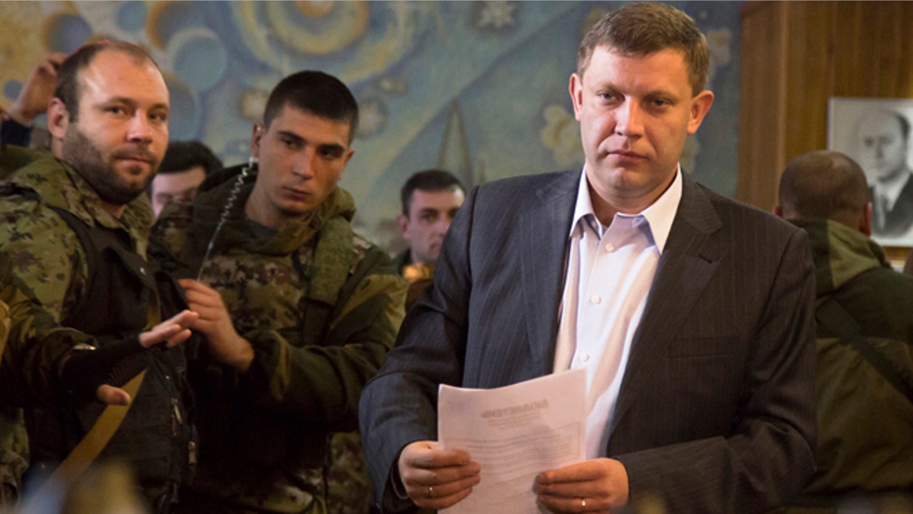 Nov. 2, 2014: Pro-Russian rebel leader Alexander Zakharchenko prepares to casts his ballot during supreme council and presidential elections in the city of Donetsk, eastern Ukraine.