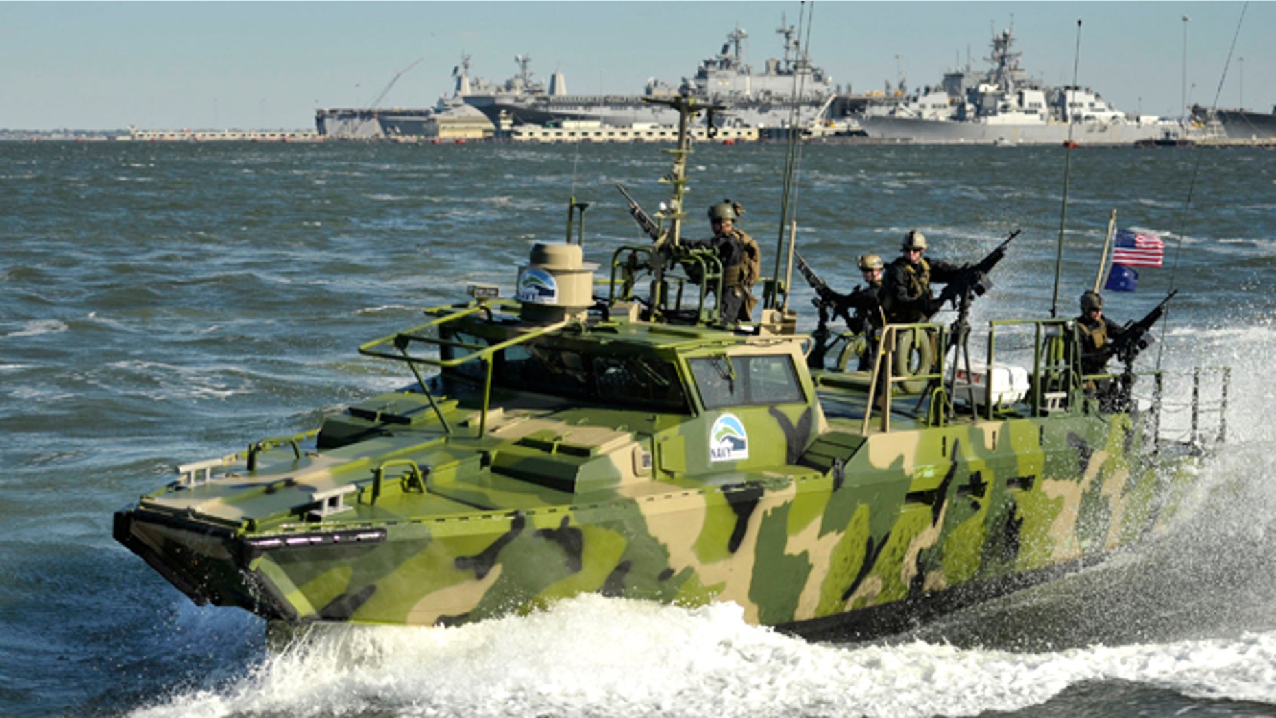 Sailors assigned to Riverine Group 1 conduct maneuvers aboard Riverine Command Boat (Experimental) (RCB-X) at Naval Station Norfolk, Va. on Oct. 22, 2010. The RCB-X is powered by an alternative fuel blend that's 50 percent algal and 50 percent NATO F-76 fuel, reducing the total energy consumption on naval ships.