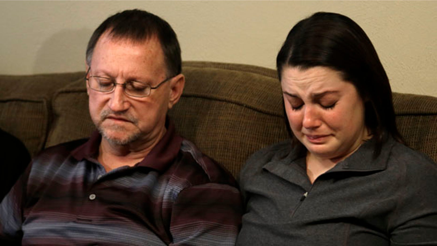 Jan. 22, 2013: Mike Lovelady, left, sits with his niece Erin Lovelady as she cries and talks about her father Victor Lovelady.