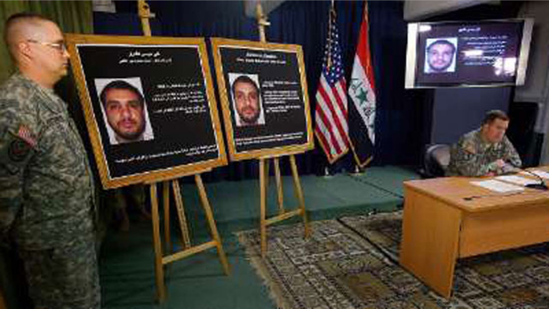 Brigadier-General Kevin J. Bergner, U.S. military spokesman in Iraq, speaks to the media next to a picture of Ali Mussa Daqduq, a captured senior Lebanese Hezbollah operative, at the heavily fortified Green Zone area in Baghdad July 2, 2007.