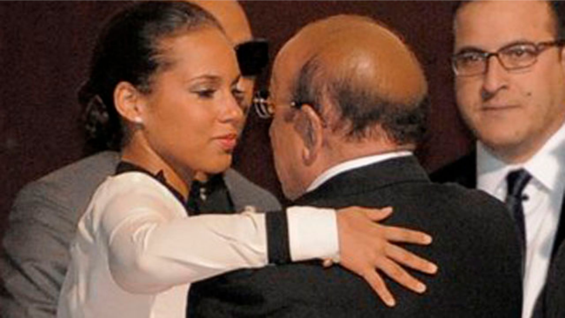 Feb. 12, 2012: Alicia Keys, left, hugs Clive Davis at the loading dock outside the Beverly Hilton Hotel.