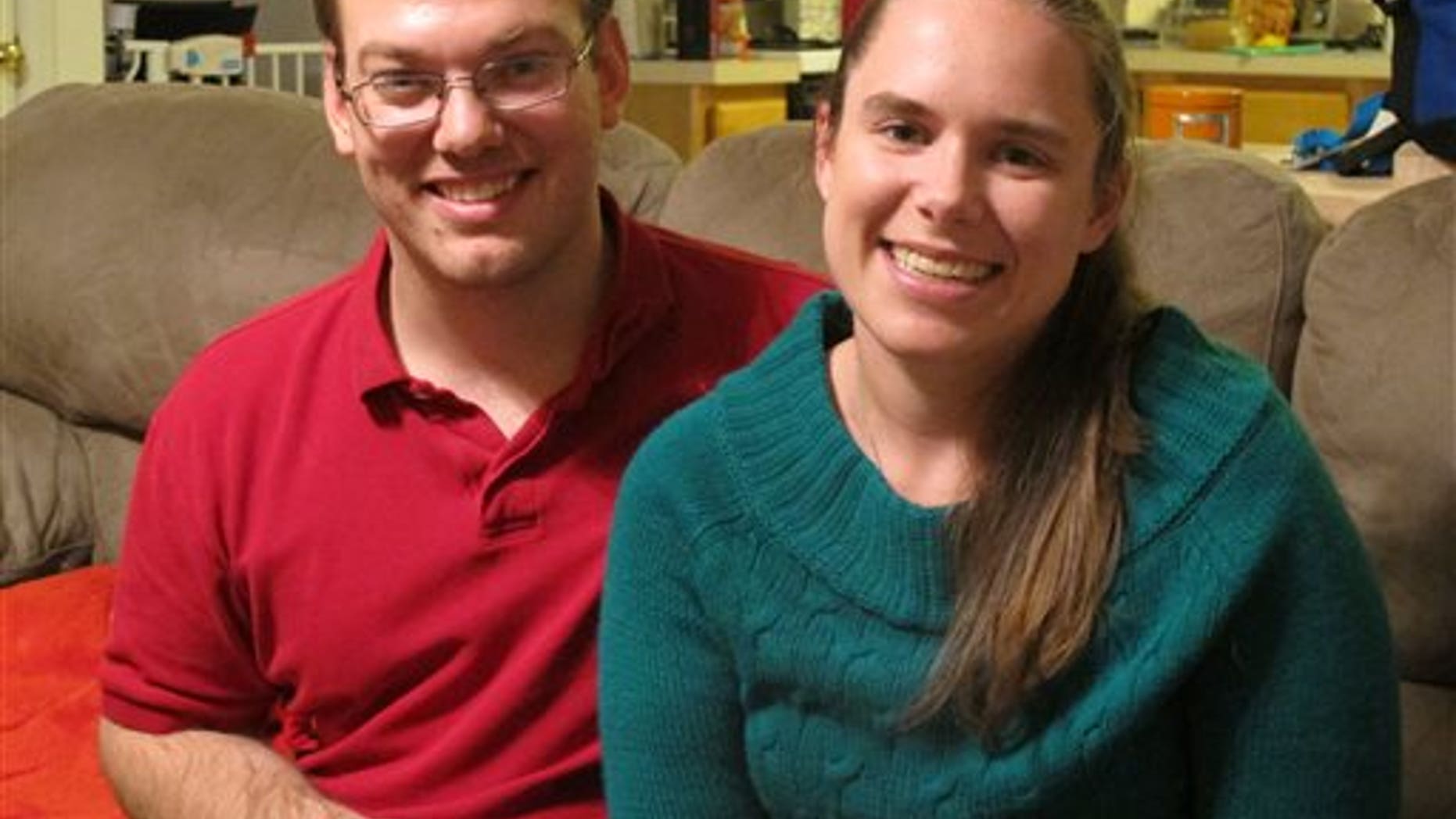 Nov. 25: Alyssa Riggan, who was the first in the United States to successfully receive a liver from a living donor 25 years ago, poses with her husband, Benjamin, in their home in Severn, Md.