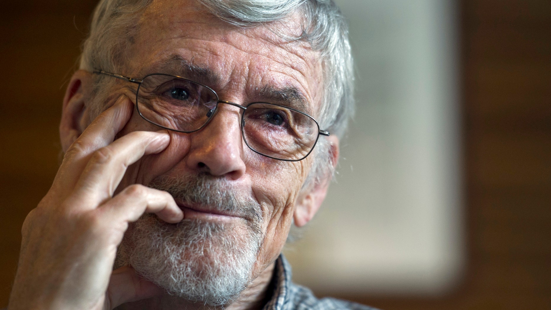 Retired physician David Hilfiker, of Washington, talks about his life with Aalzheimer's at the National Press Club in Washington, Thursday, Sept. 19, 2013. (AP Photo/Cliff Owen)